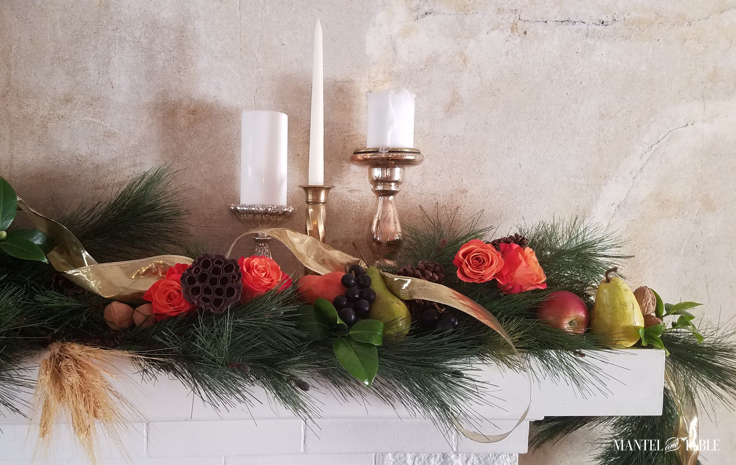 Harvest mantel featuring candles and roses