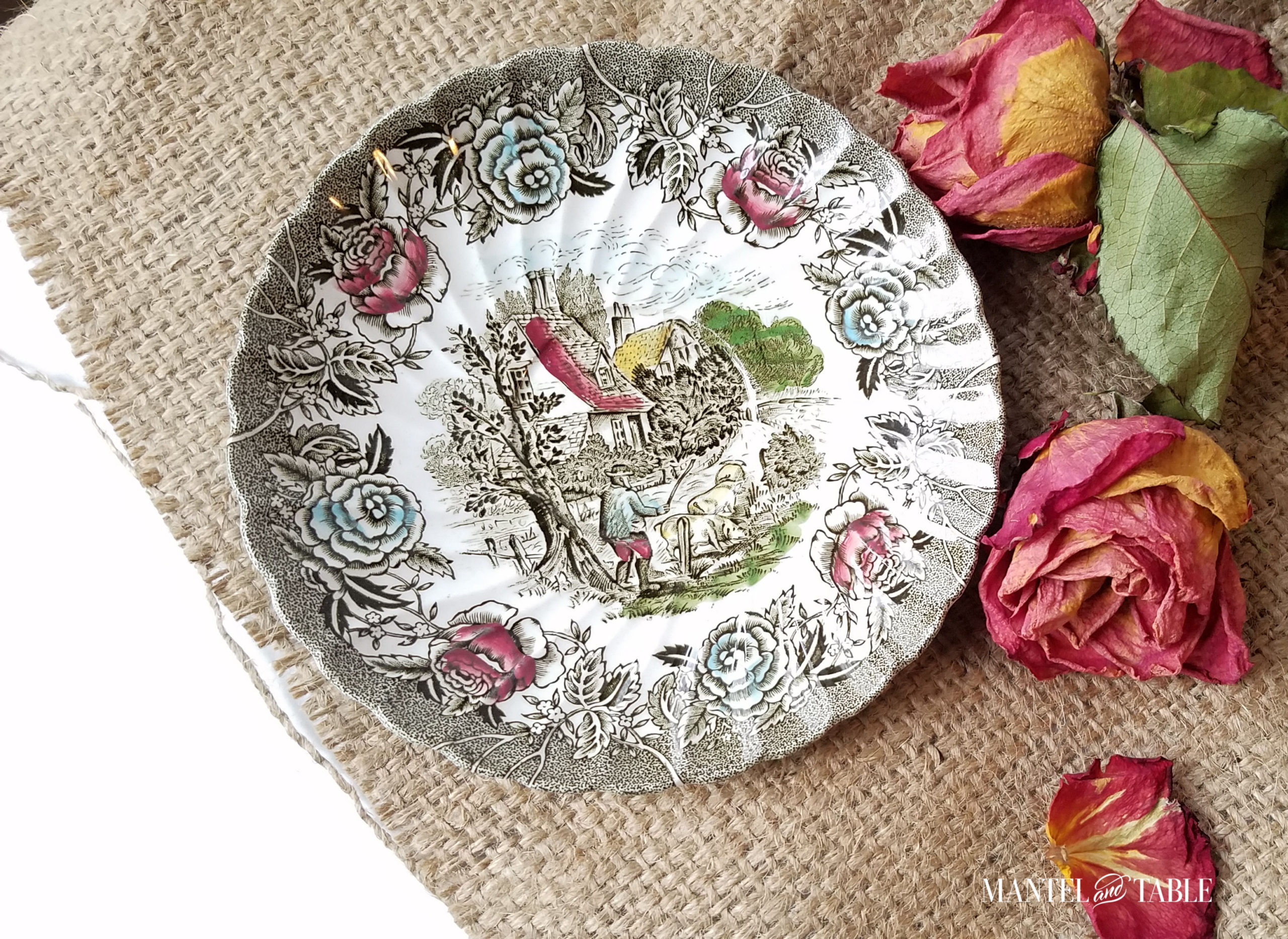 Fall Village saucer on burlap with dried roses