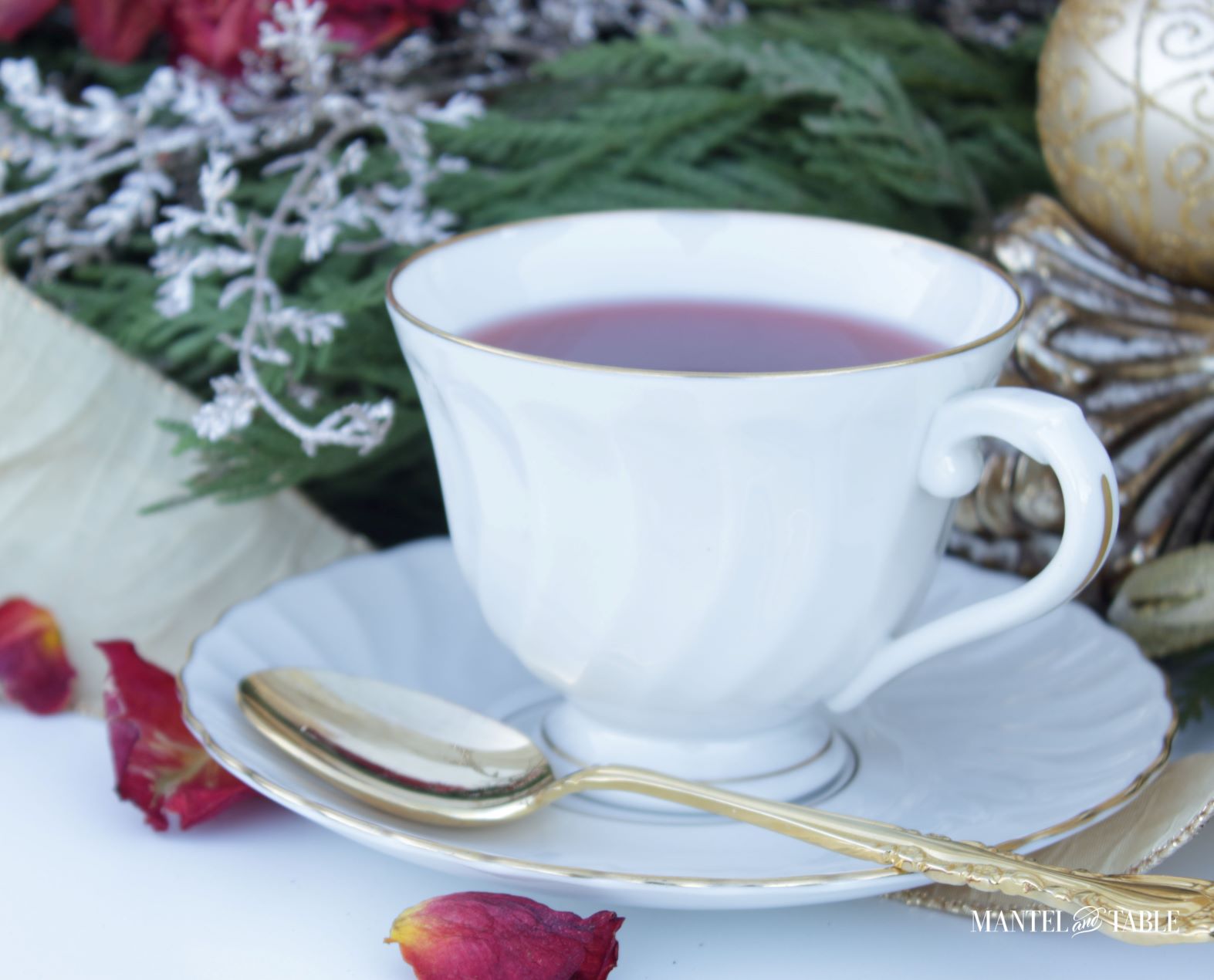 Syracuse China teacup with tea and gold spoon