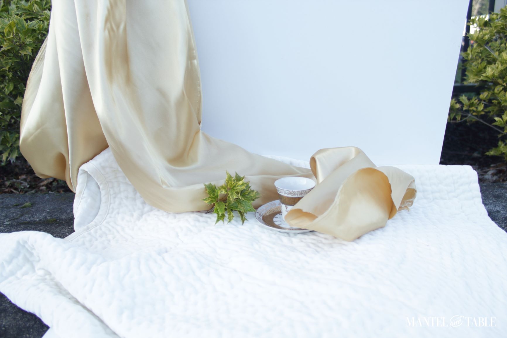 Satin blowing across the teacup