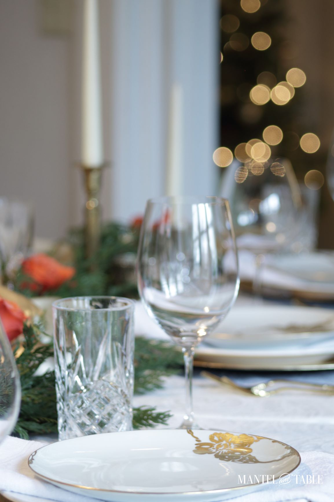 Crystal water glass and Riedel Bordeaux glass in gold satin tablescape