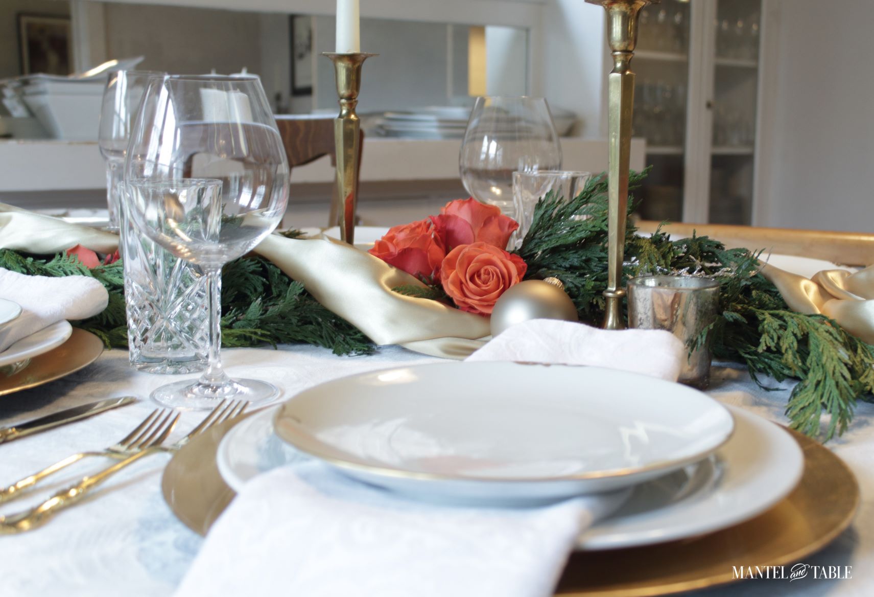 Gold and white place setting with gold satin centerpiece