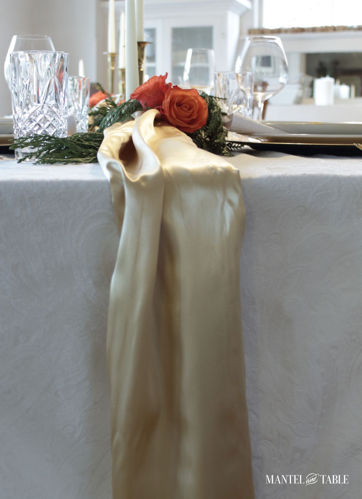Gold satin cascading down the middle of the table