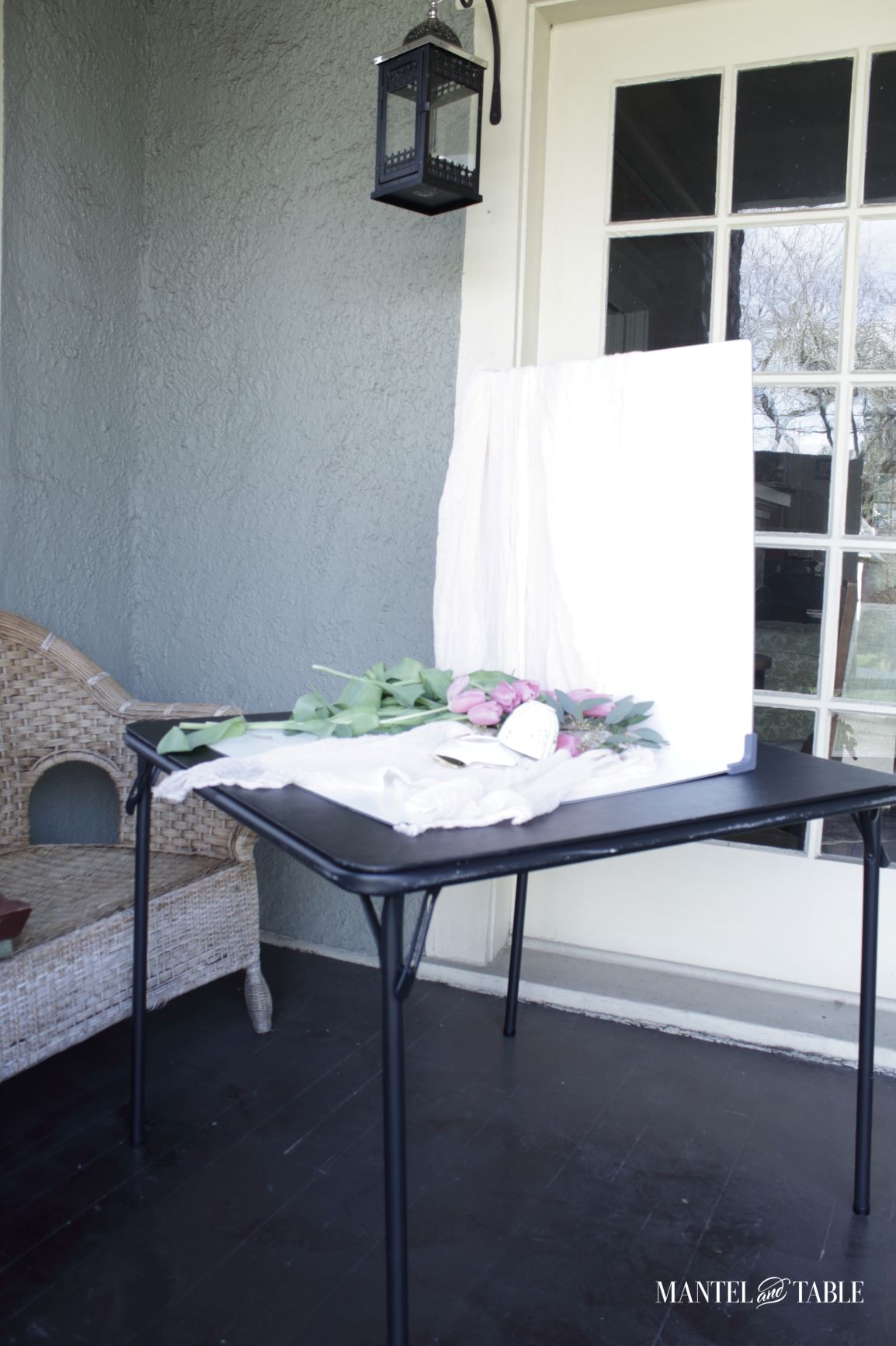 Teacup photo set up on card table on the porch.