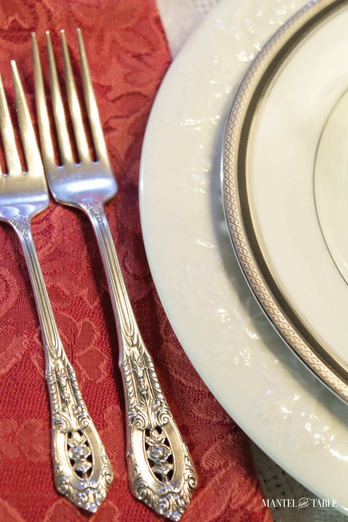 Wine Cellar Dinner ~ Silver forks on red napkin, white plates
