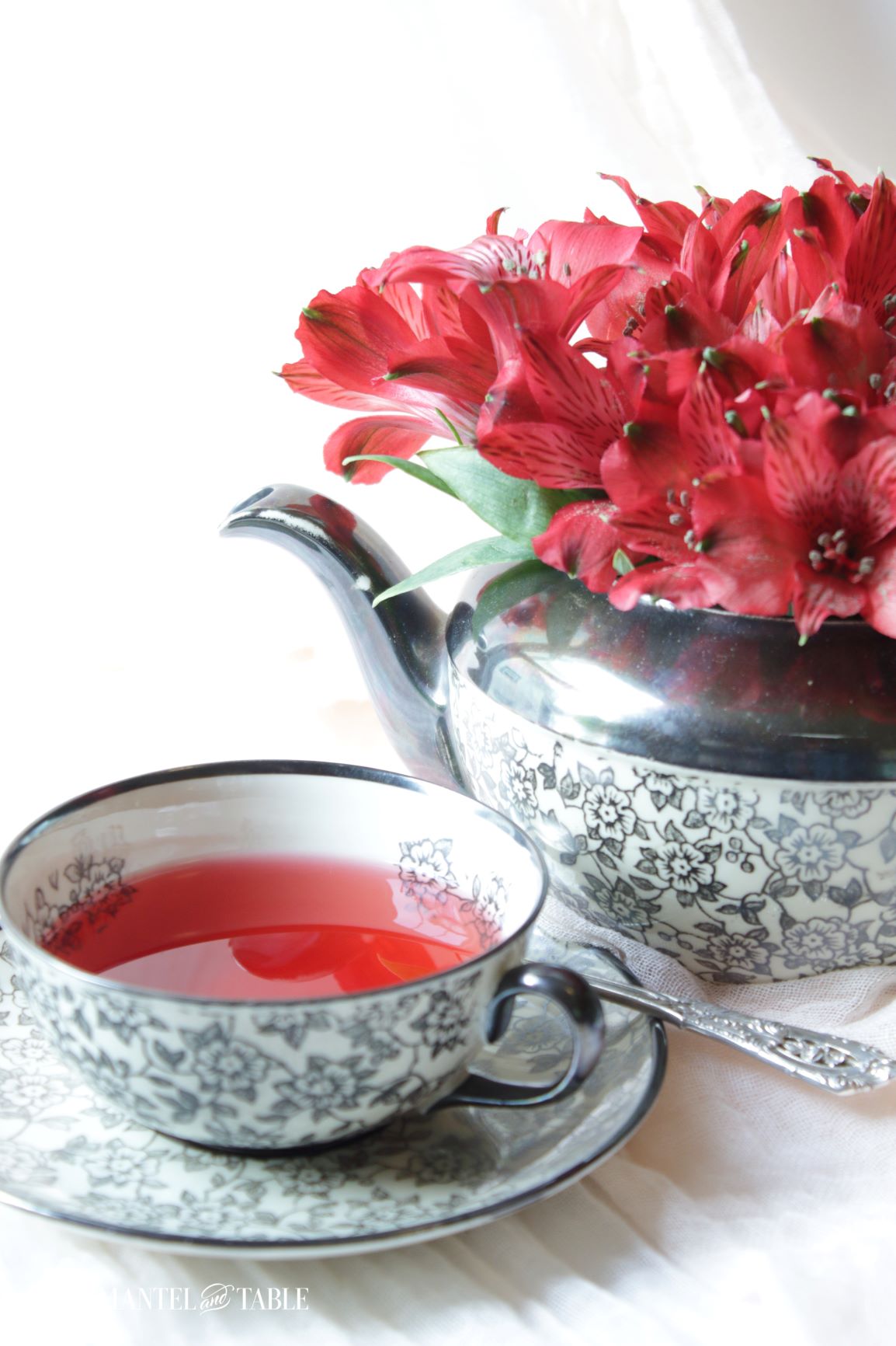 Closeup of teapot and red tea in teacup