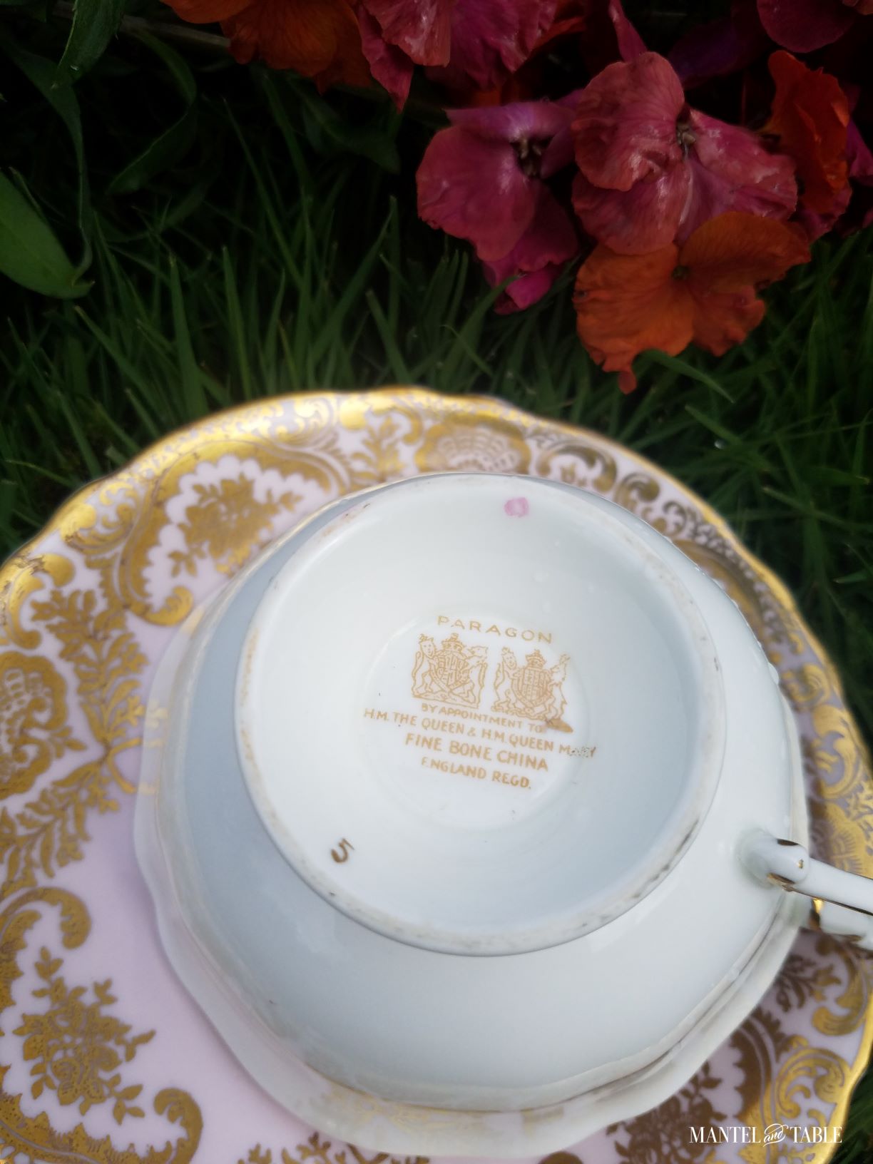 Markings on bottom of teacup showing two royal warrant stamps