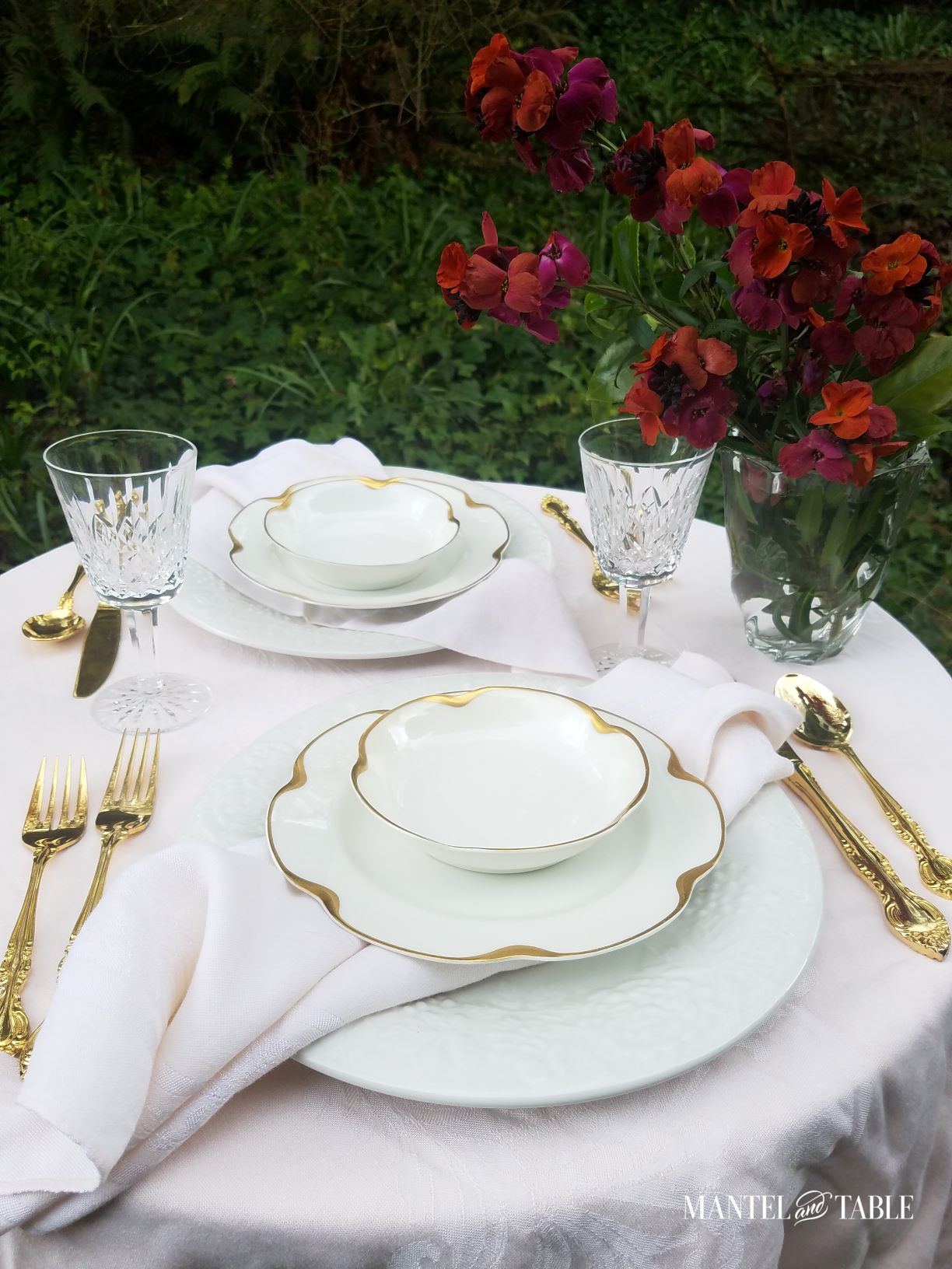 Tablescape with pale pink tablecloth and napkins