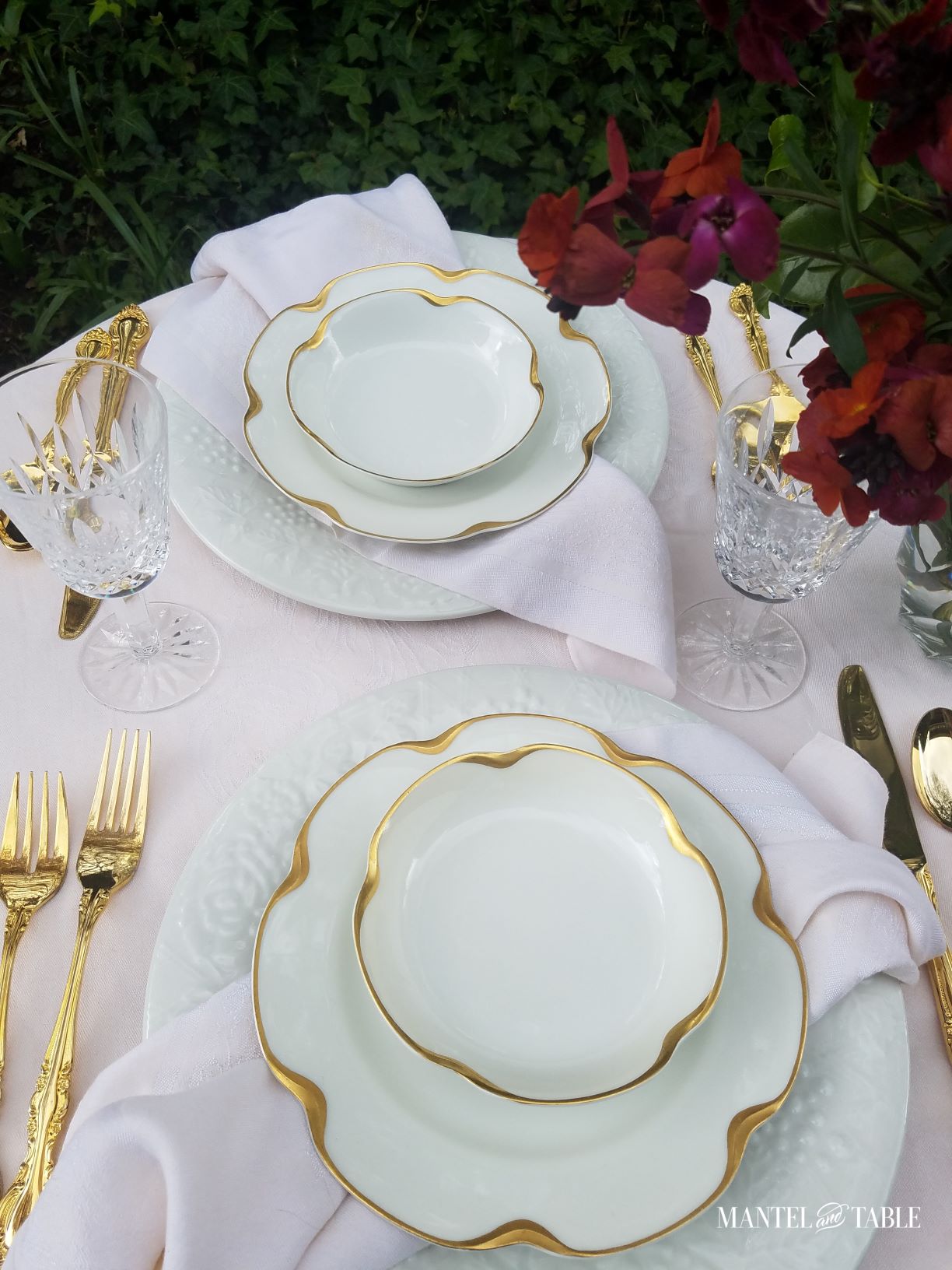 White with gold trimmed china in a pink table setting