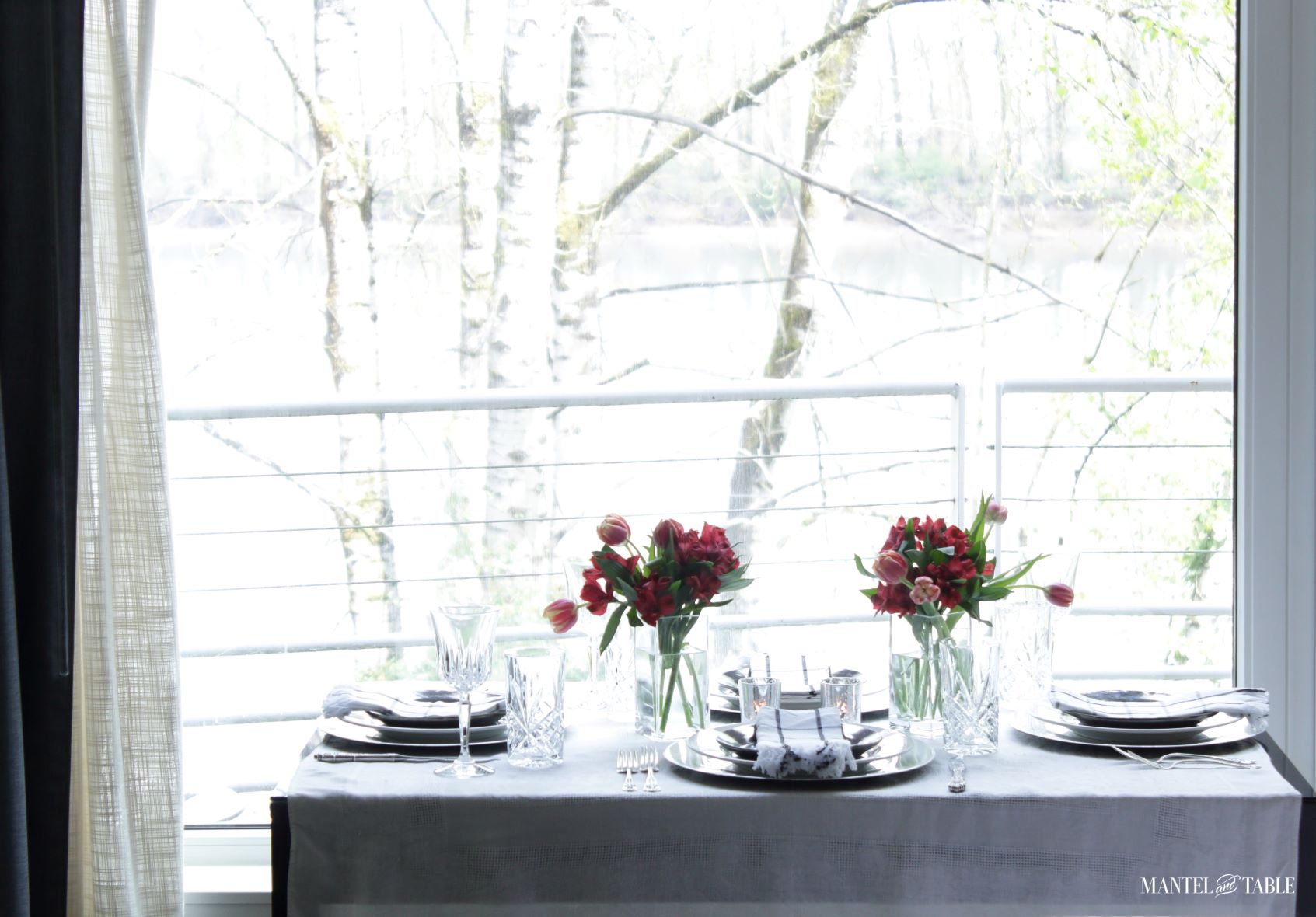 Elegant Spring Picnic tablescape full table from the side and river view