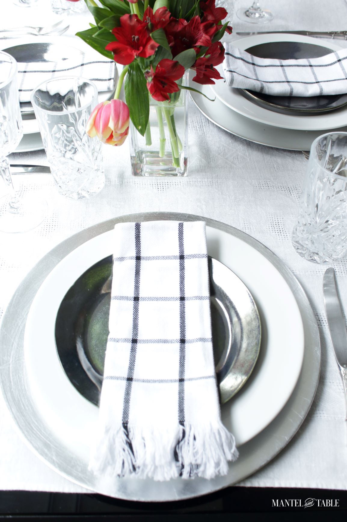 Elegant Spring Picnic tablescape place setting closeup with black table edge