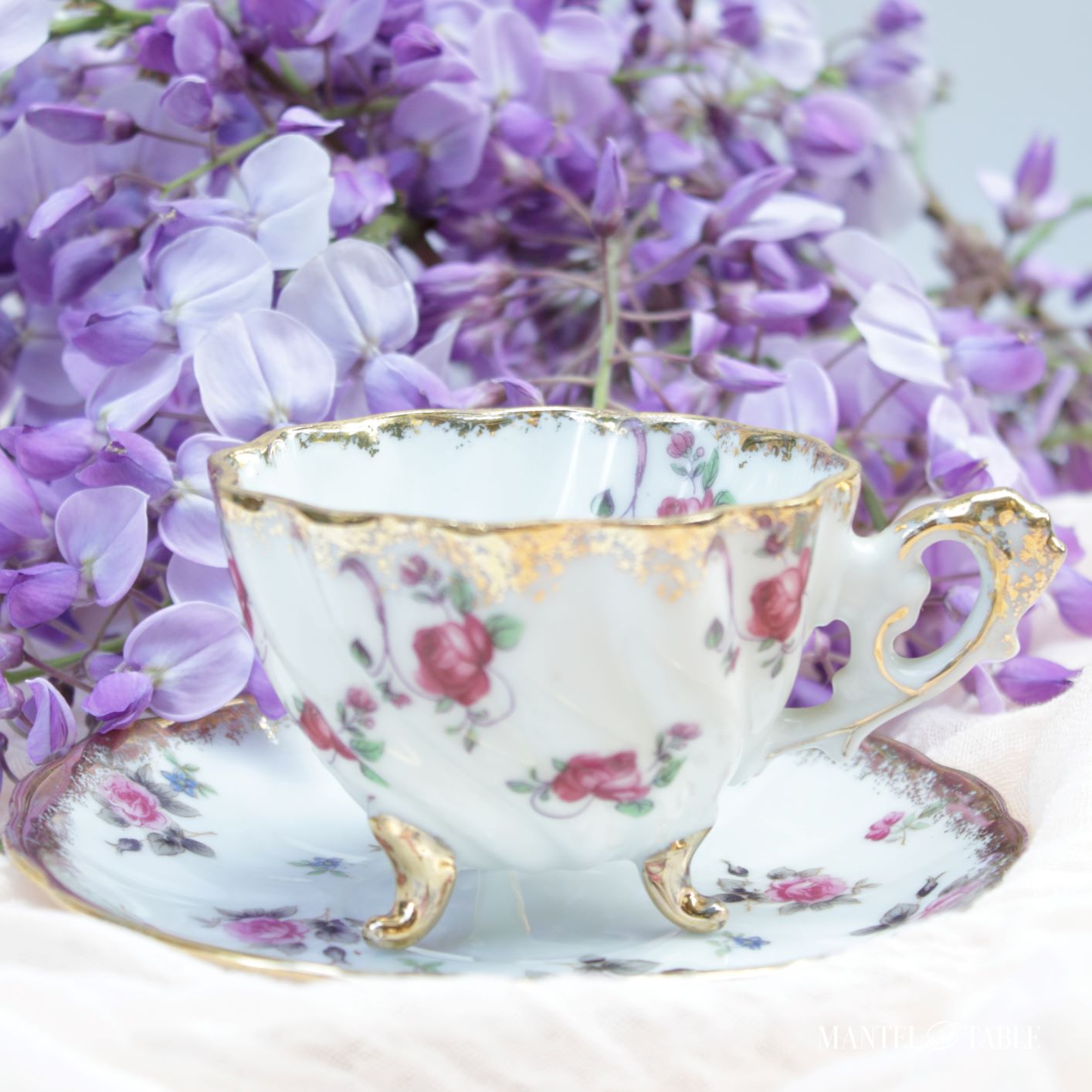 7 Teacup gift ideas ~ teacup and saucer in front of wisteria blooms
