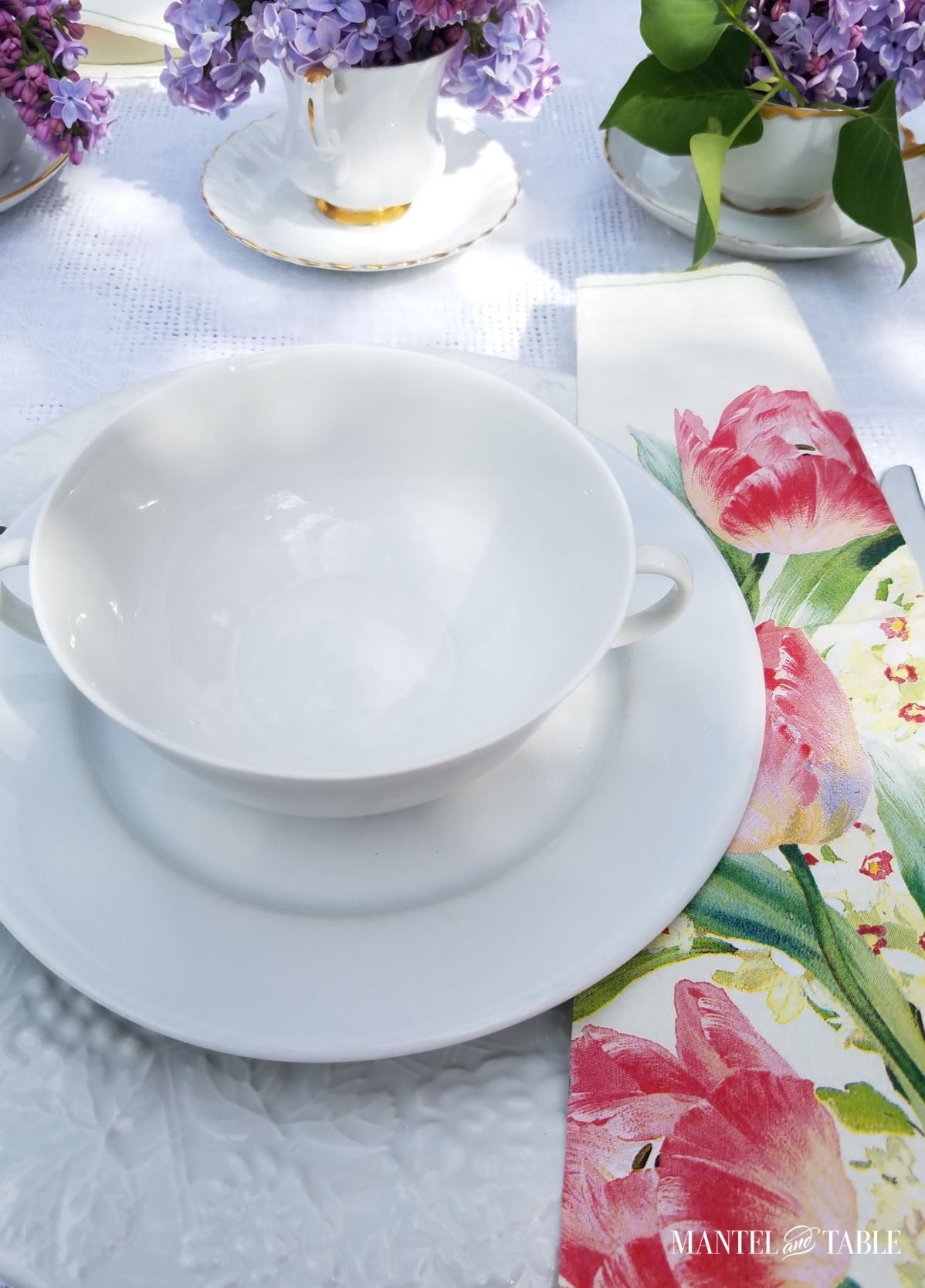 Bright spring tablescape ~ white linens and china