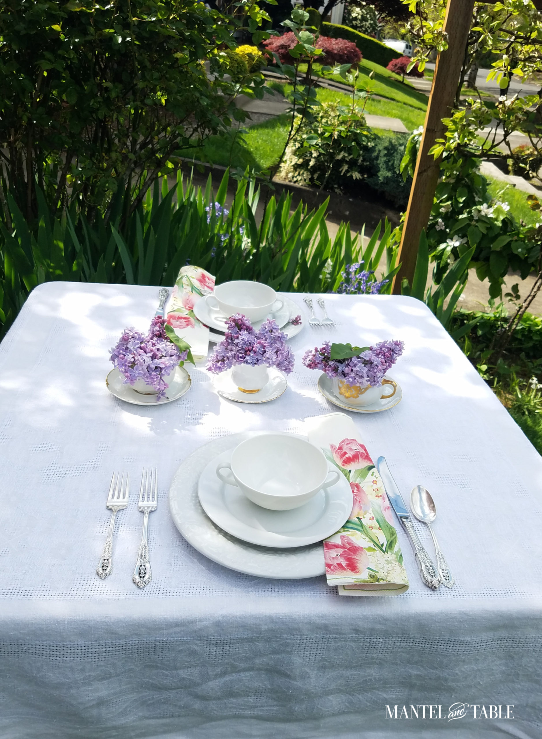 Bright spring tablescape set up in the yard