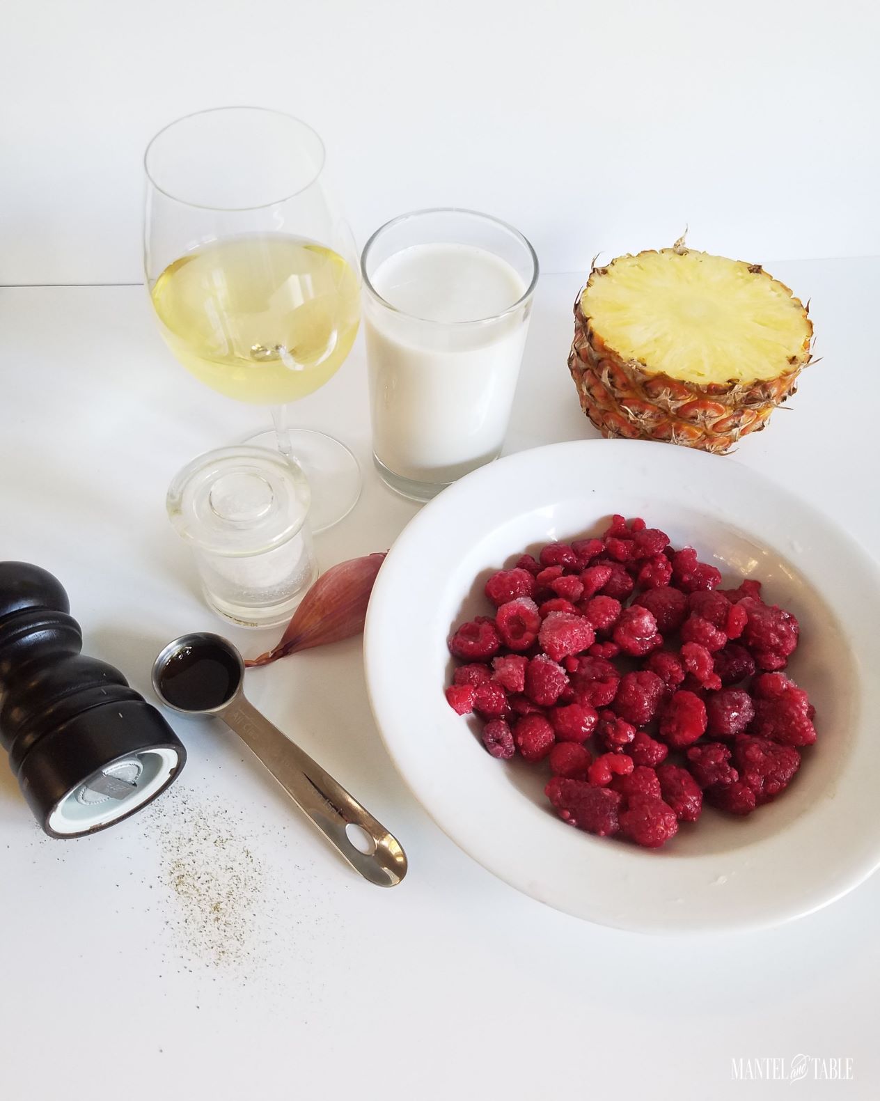 Chilled raspberry soup ingredients, including wine and vanilla