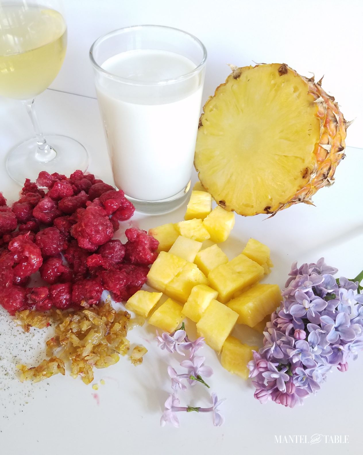 Ingredients on white background with lilacs