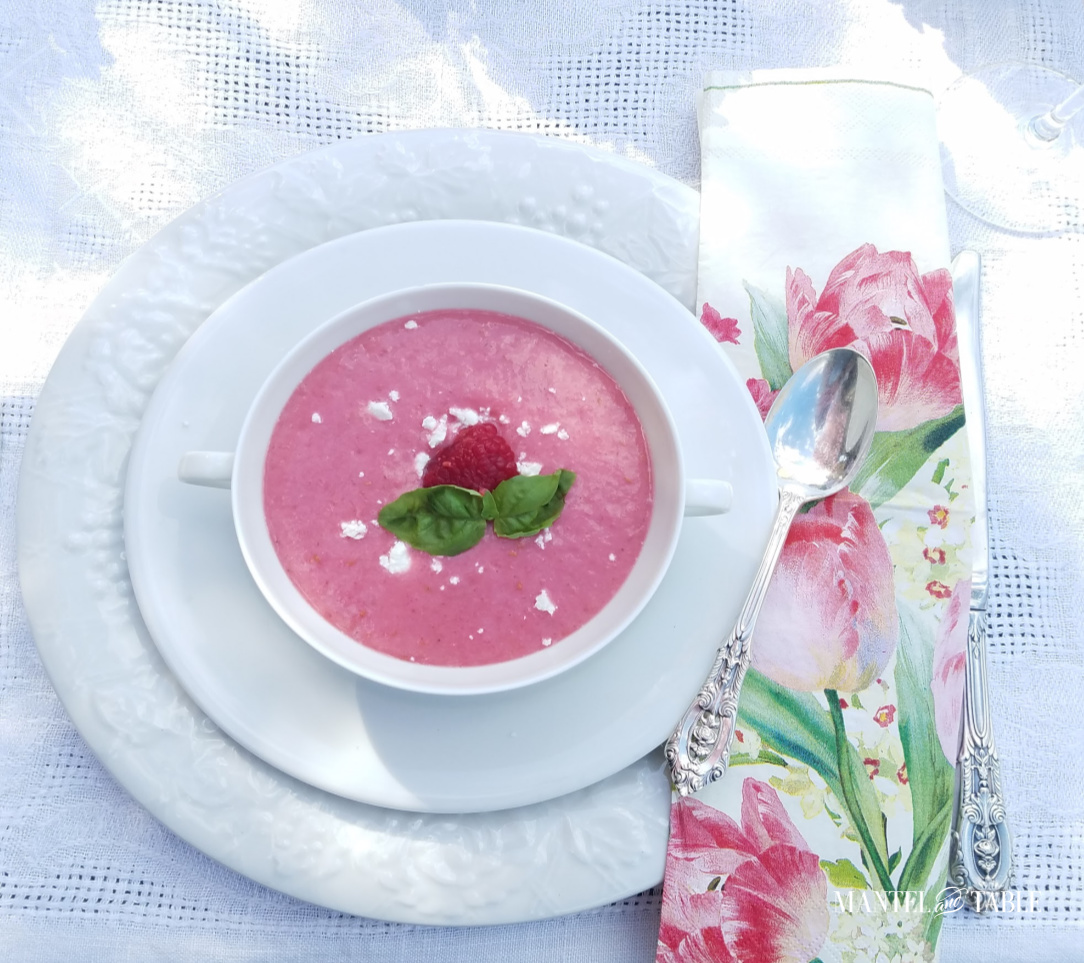 Chilled raspberry soup in white bowl