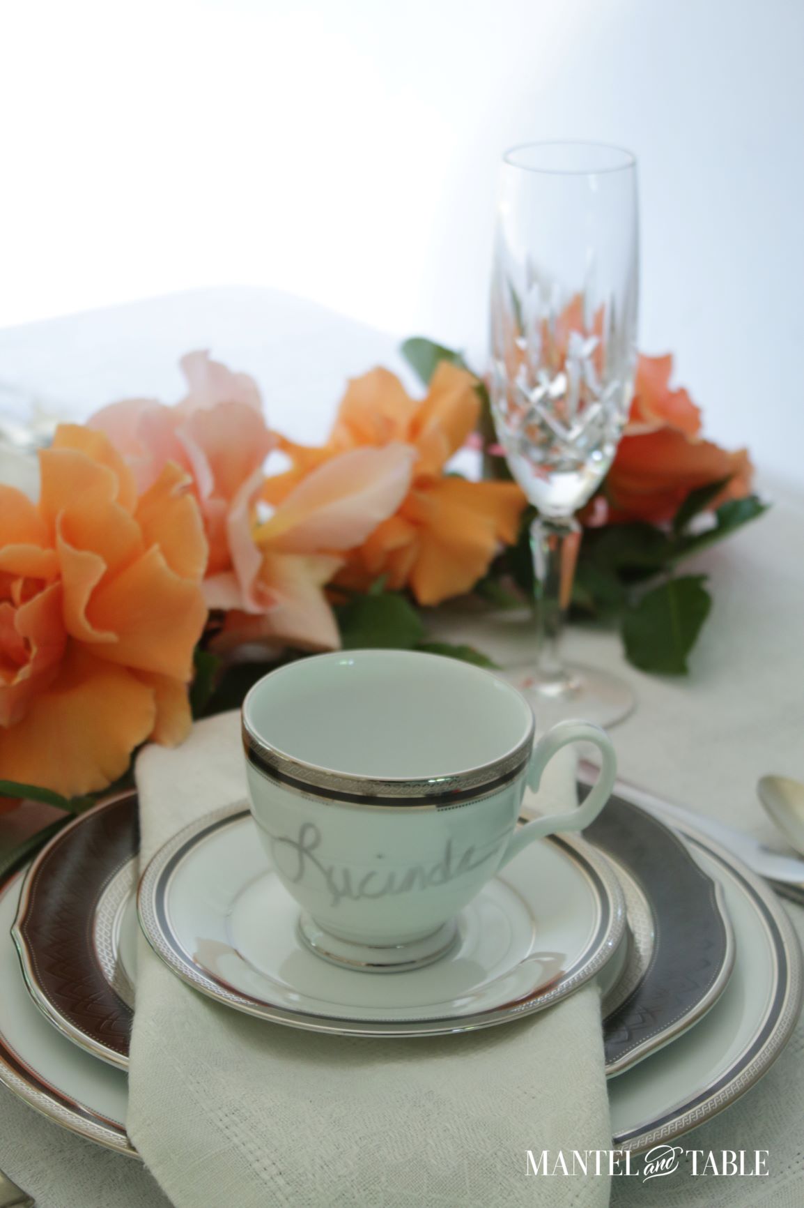 Teacup place card ~ Name written on teacup set on a plate stack