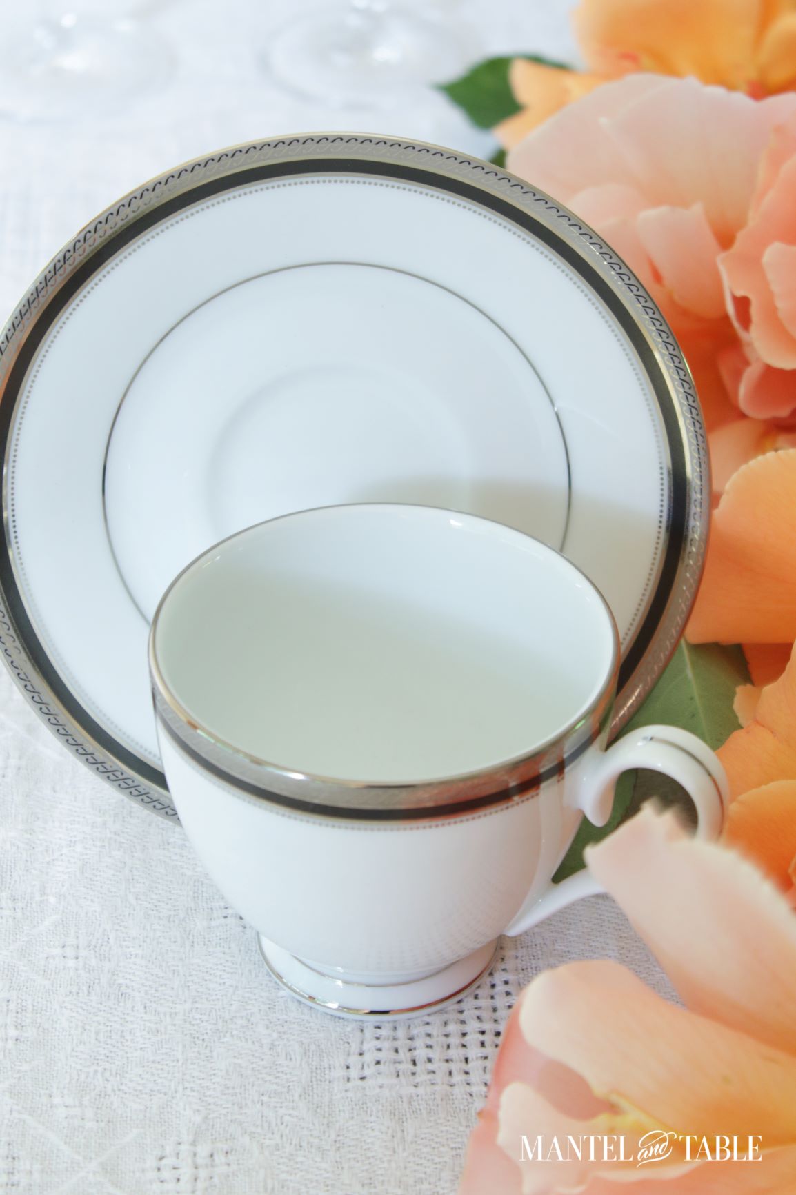 cup and saucer with peach garden roses