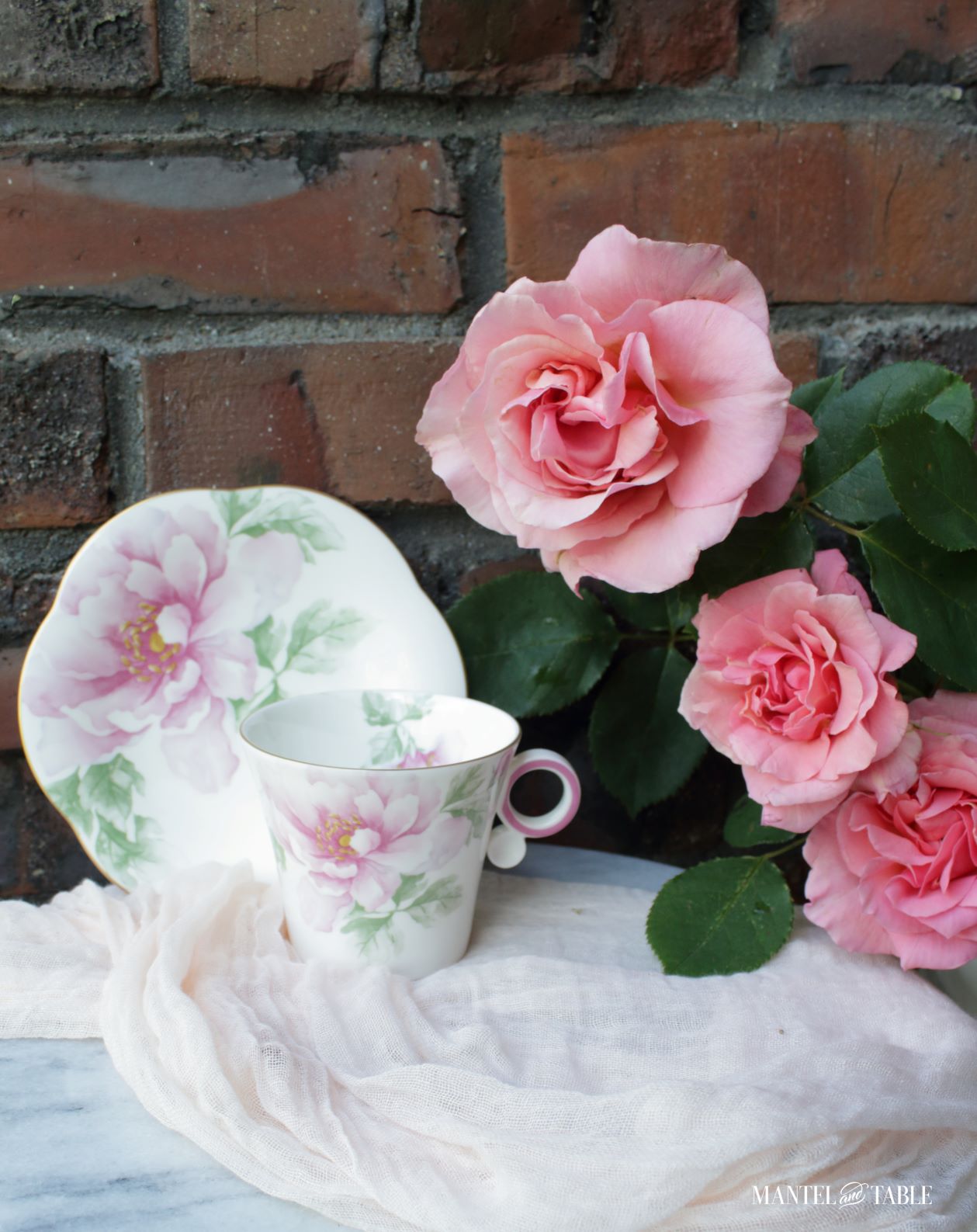 Pink flowered teacup and saucer, the Traveling Teacup, with pink roses