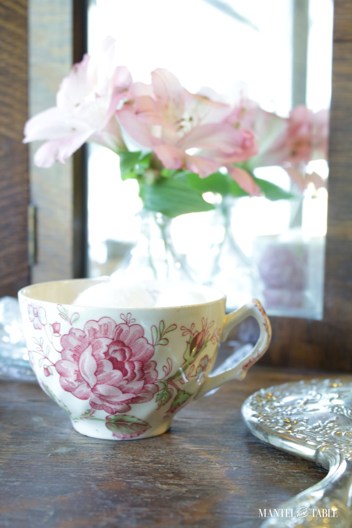 Teacup holding cotton balls on dressing table