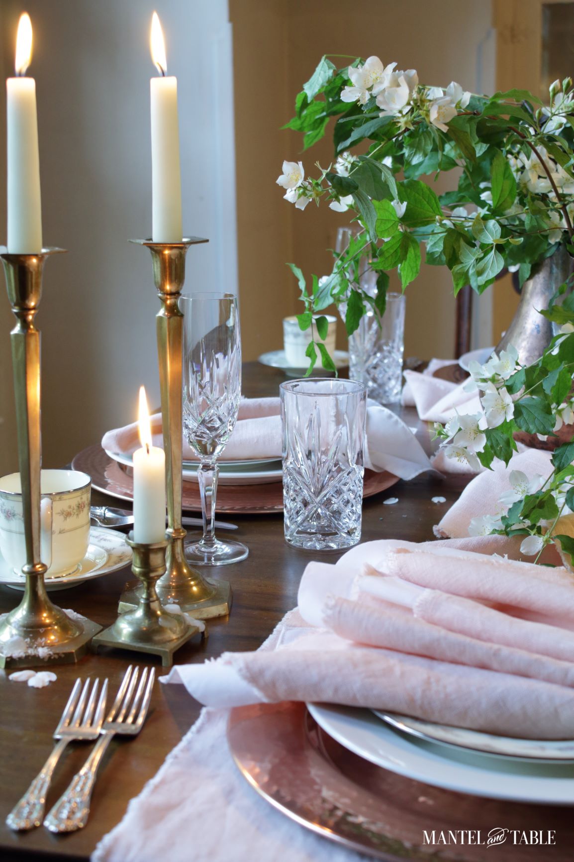 Blush table linens tablescape with brass candlesticks