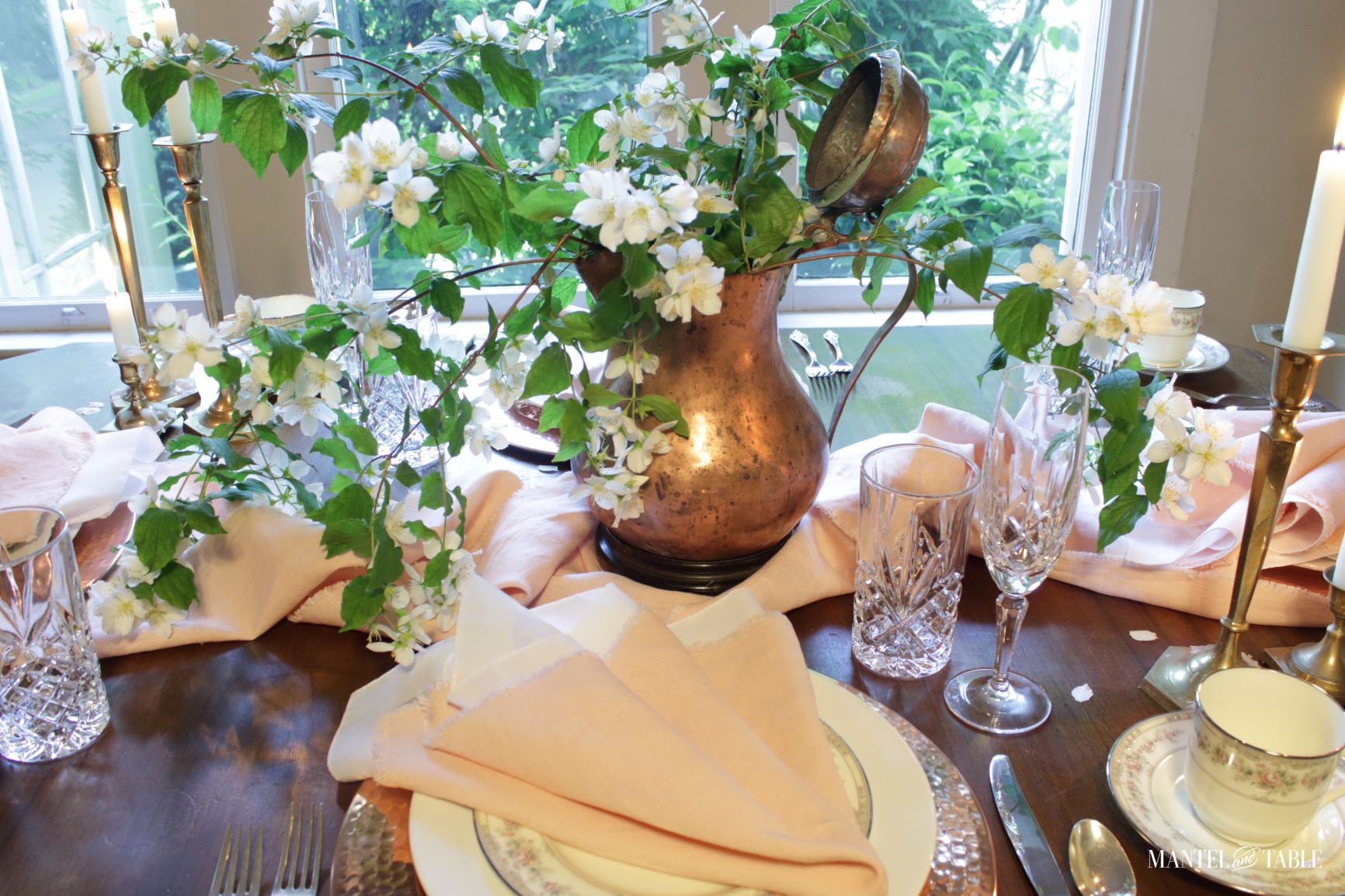 Blush table linens place setting from above