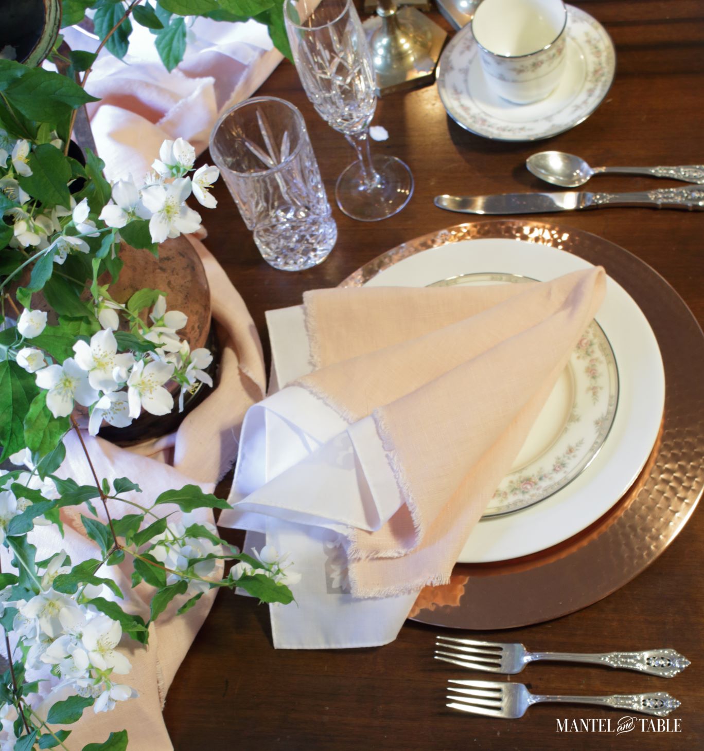 Blush table linens place setting from above