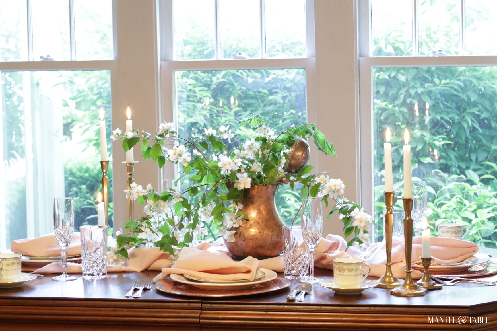 Tablescape with blush table linens and copper