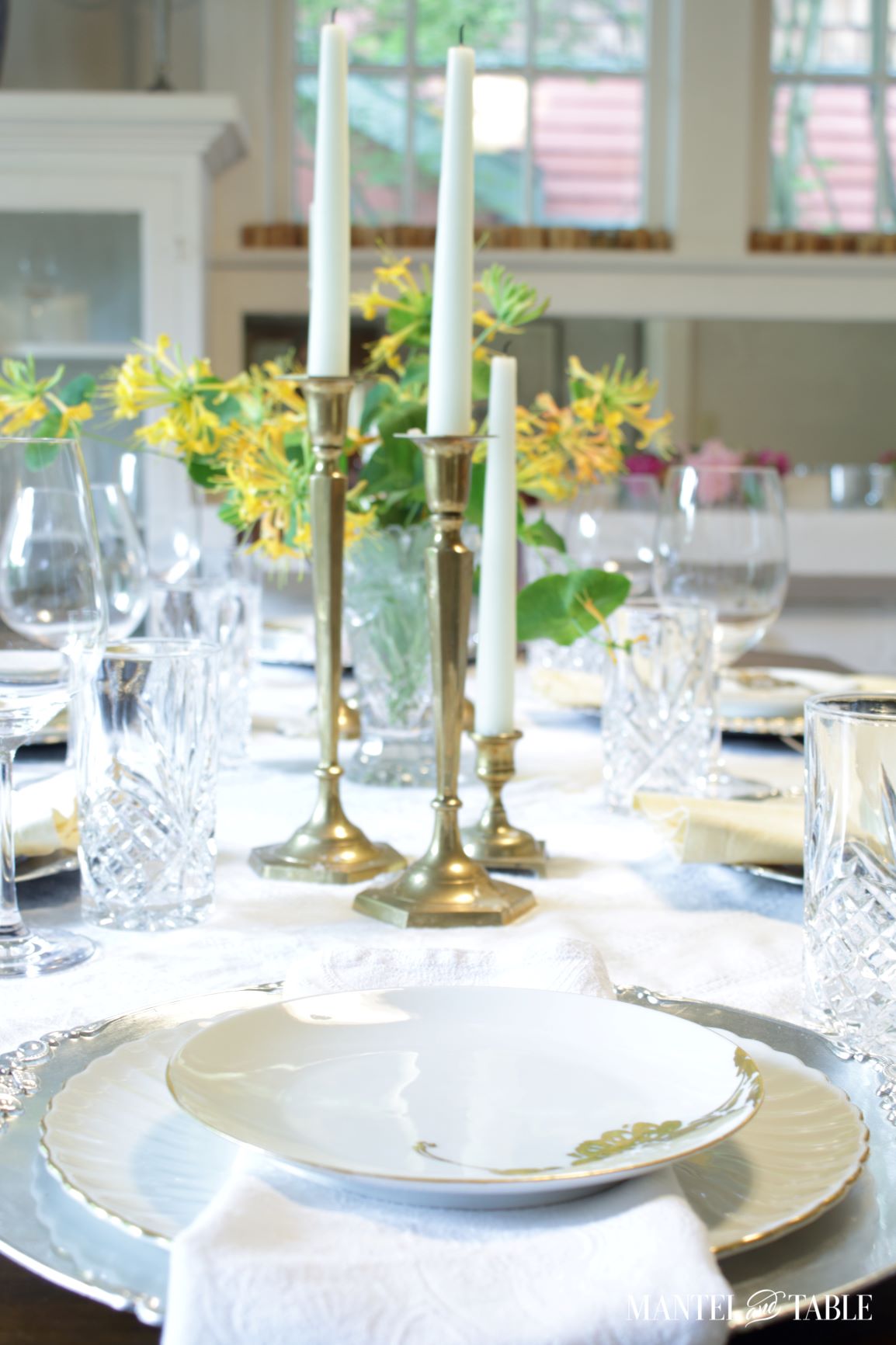 A fully set table with honeysuckle