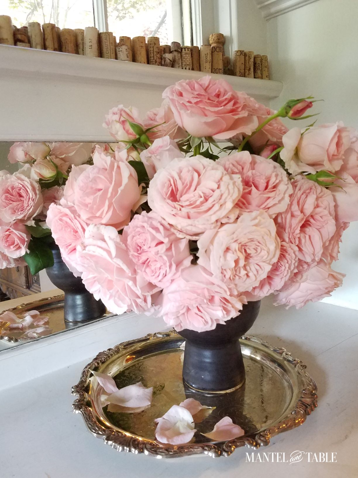 Big arrangement of pink roses on white counter