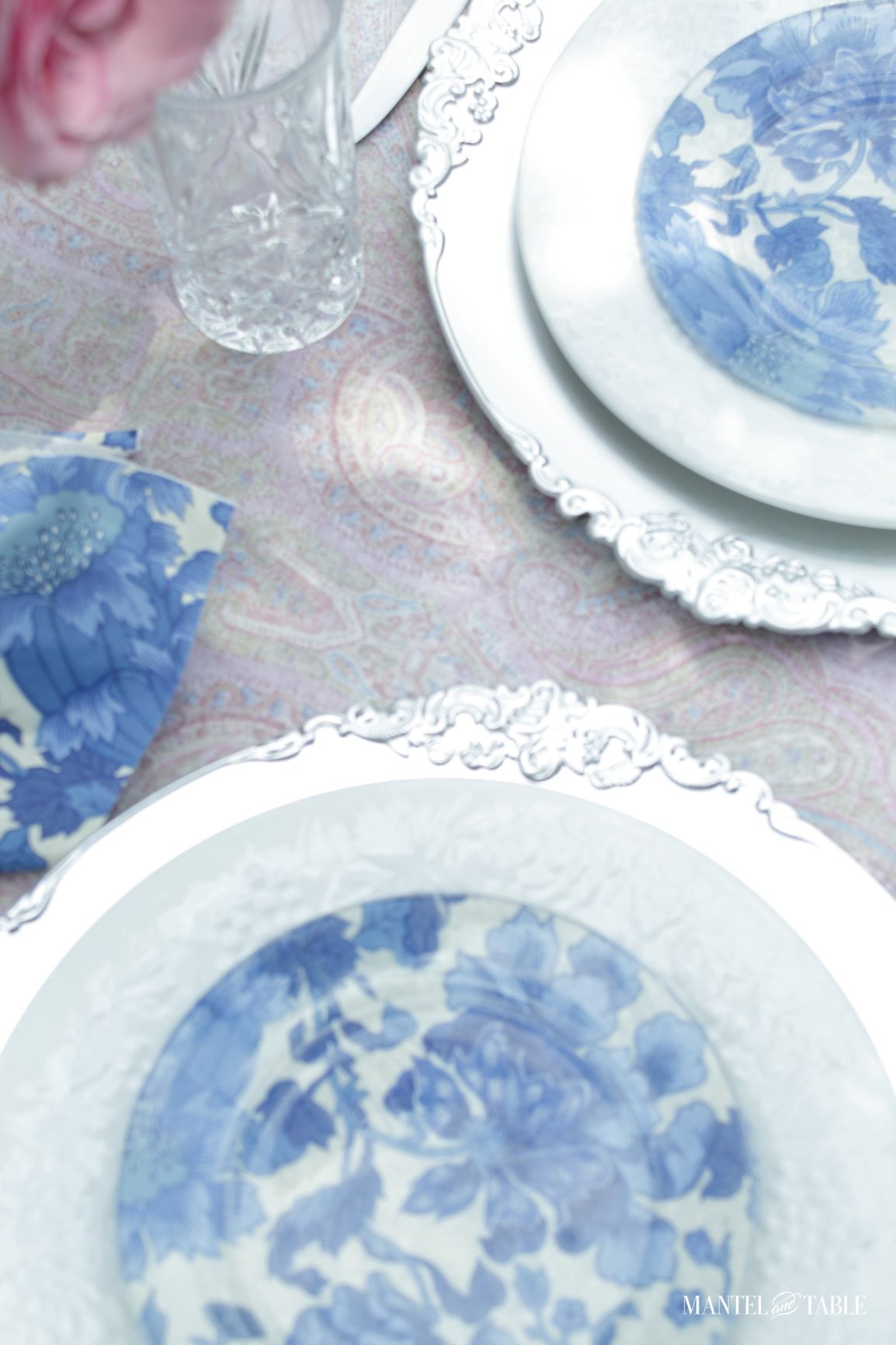 Top view of pink roses, plate stack
