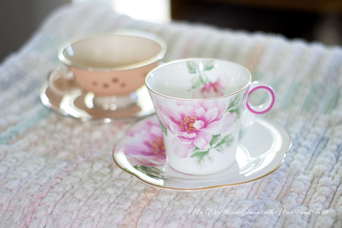 Two teacups & saucers on a blanket