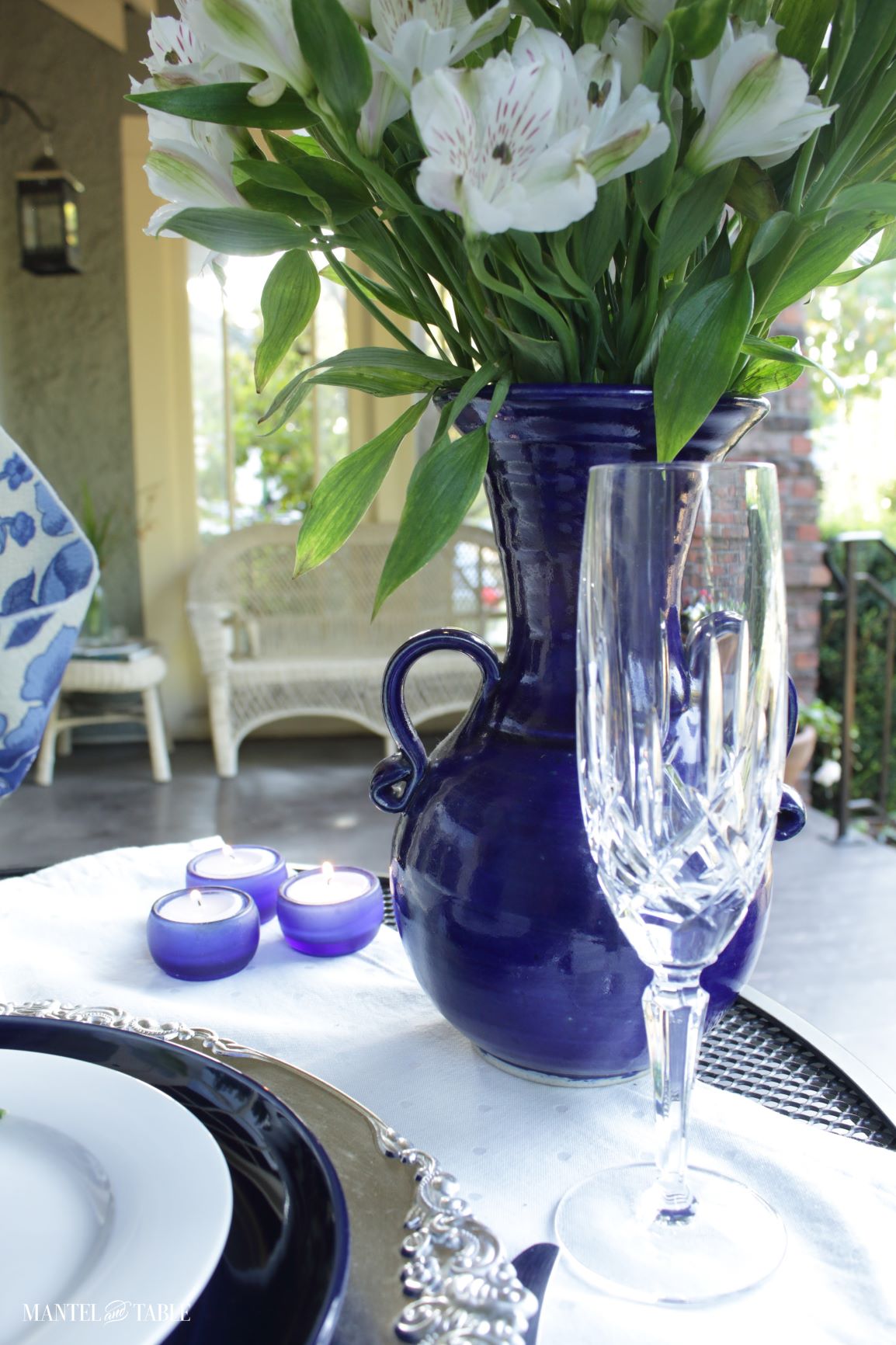 Cut crystal champagne flute in blue and white tablescape