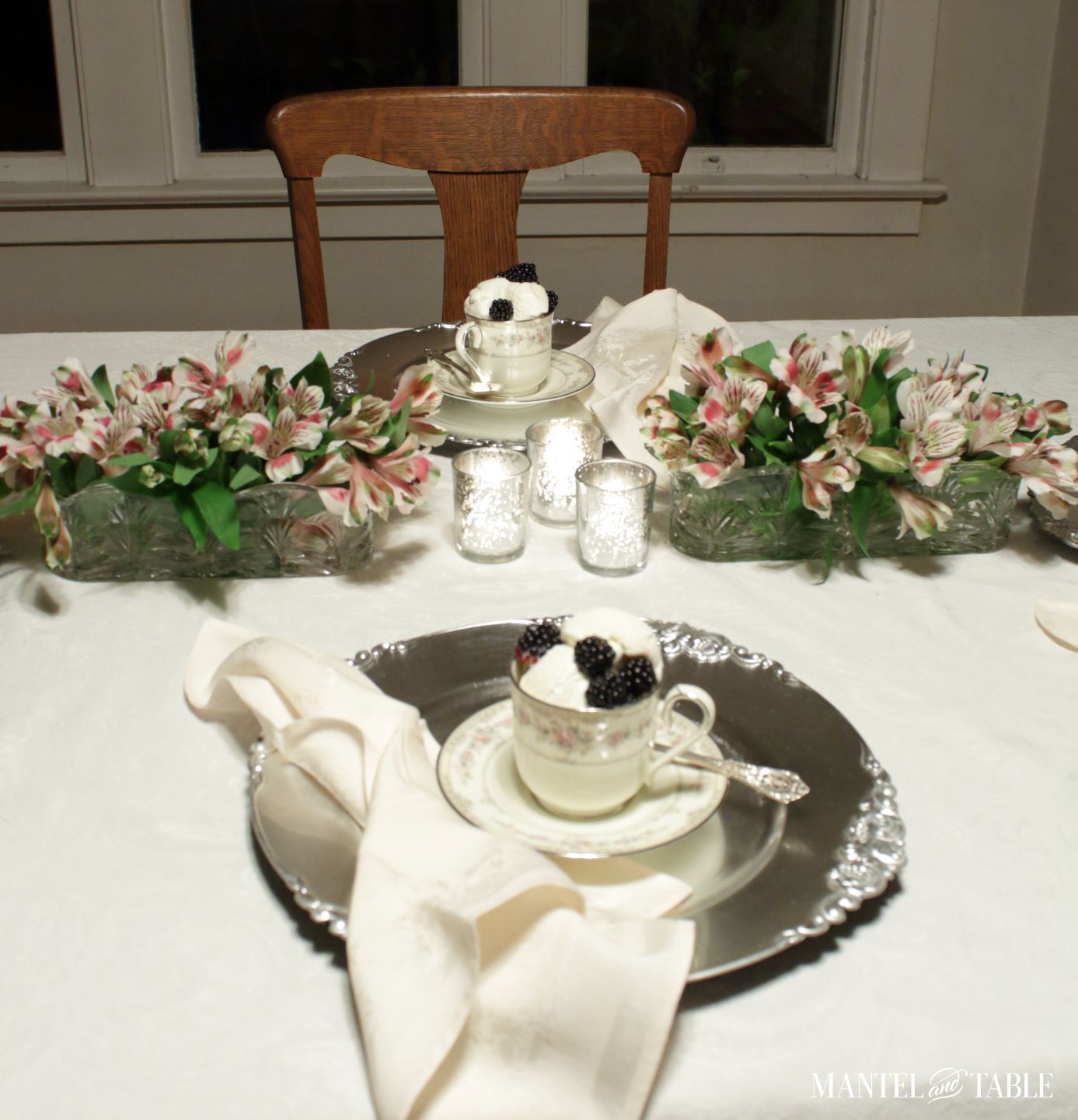 two placesettings with teacup and saucers on chargers