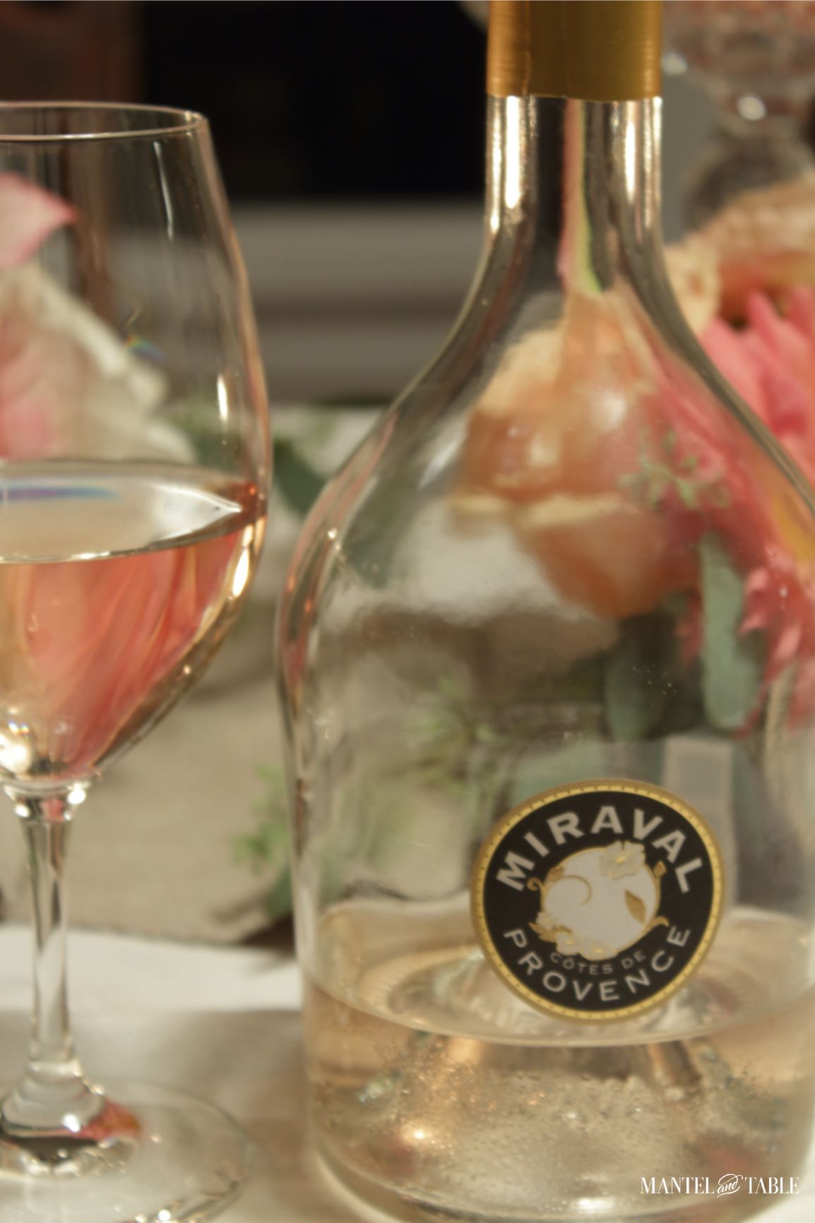 Miraval wine bottle and glass of wine
