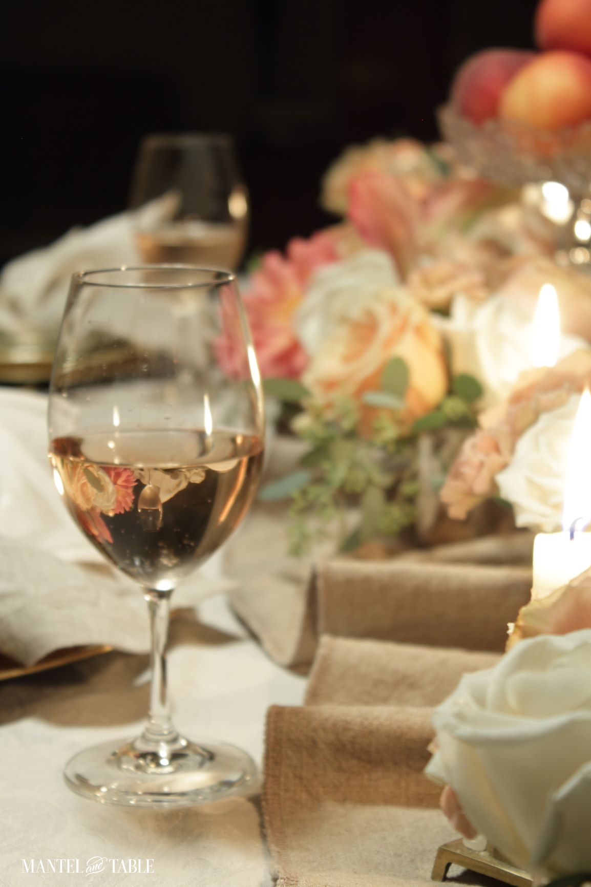 peach tablescape with wine glass