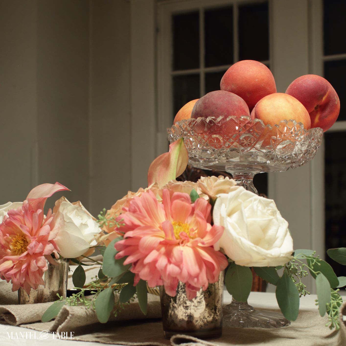 peaches and flowers on the table