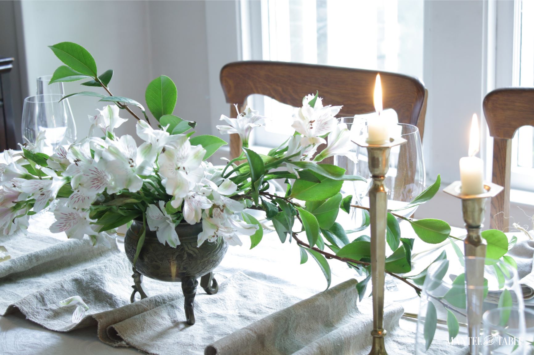 View of table runner, candles, and flowers from top