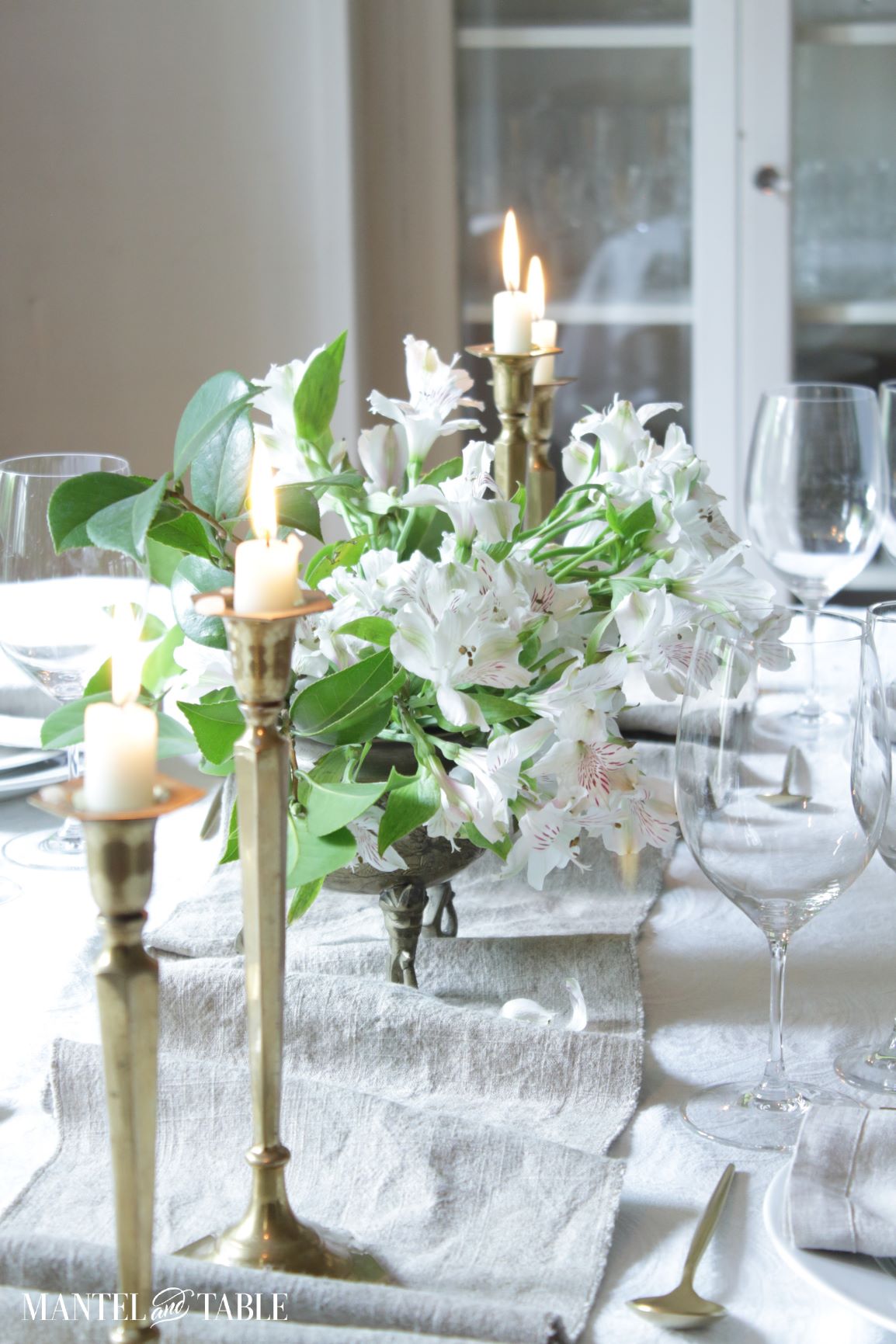 Long view of centerpiece and candles on table runner