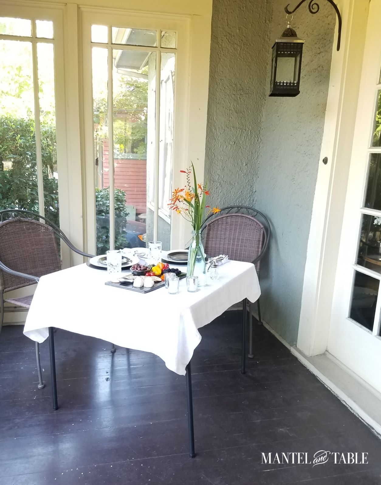 Porch table set for dinner