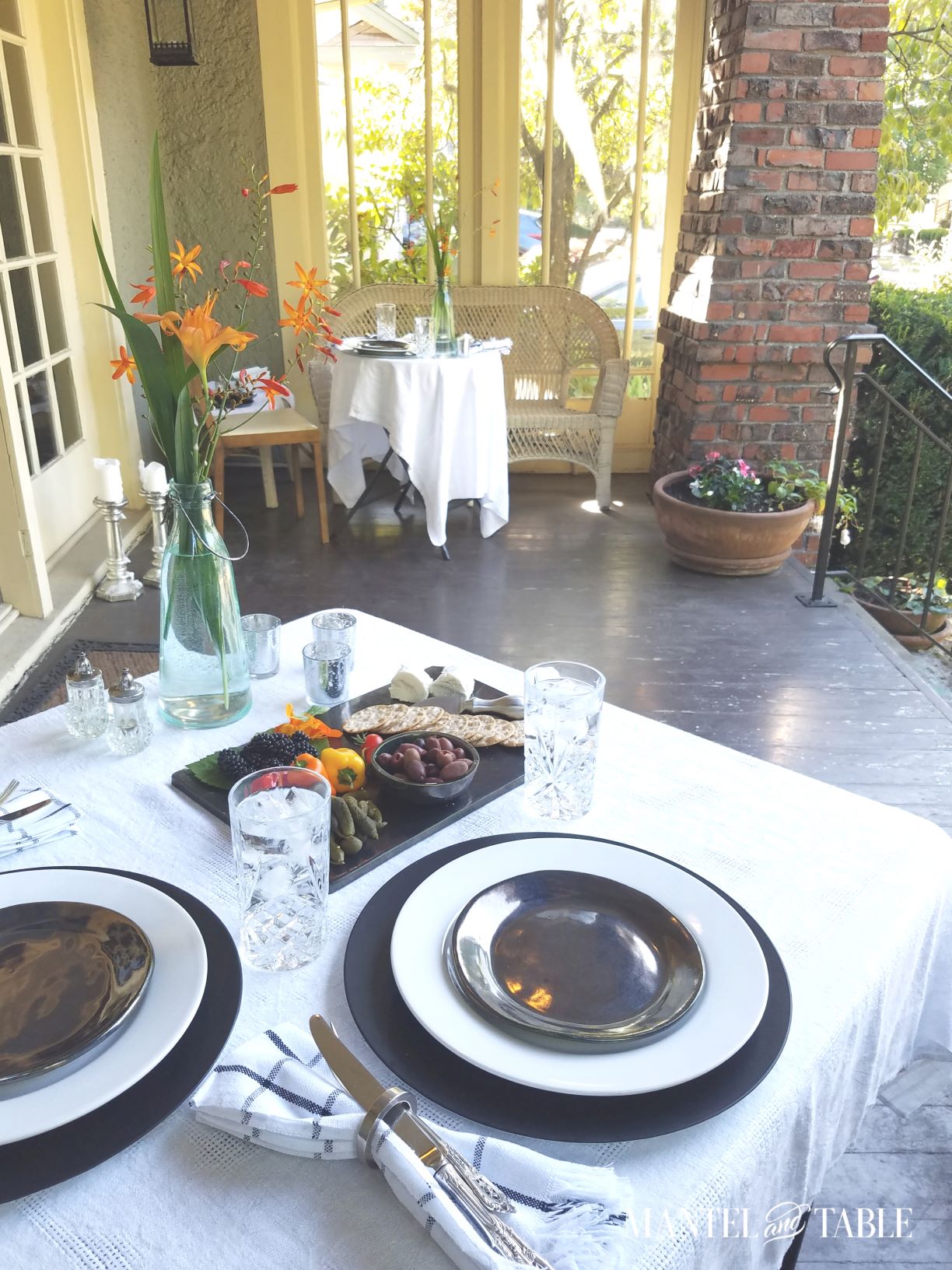 two social distancing tables on a porch