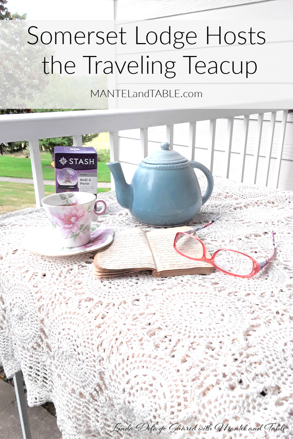 Teacup at Somerset Lodge on table with teapot, box of tea, notebook, and reading glasses. Pinterest banner