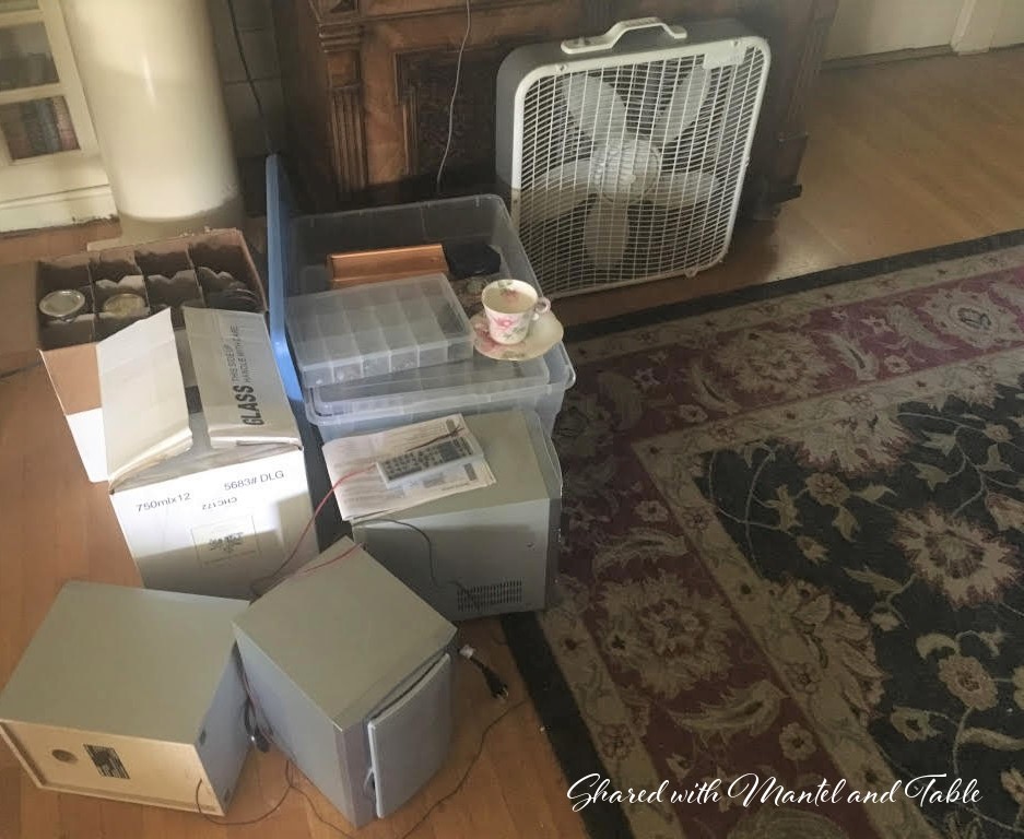 Stack of storage boxes on the floor with oriental rug