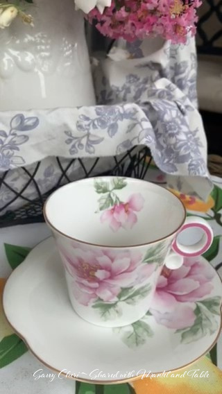 Close up of Pink & white flowered teacup and saucer with pink and white flowers