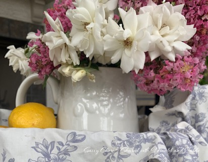 Closeup of tea party flowers, white roses and pink crepe myrtle