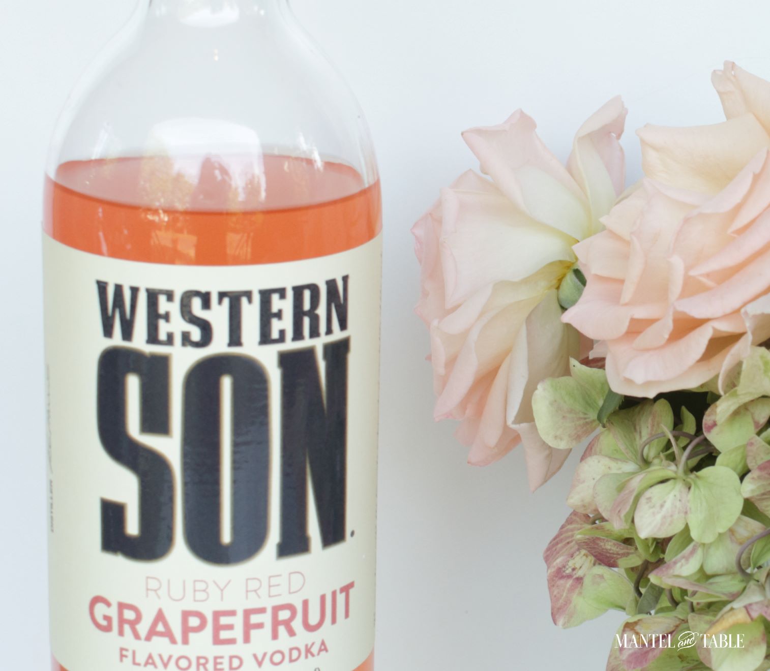 Closeup of the Western Son vodka label, pink roses