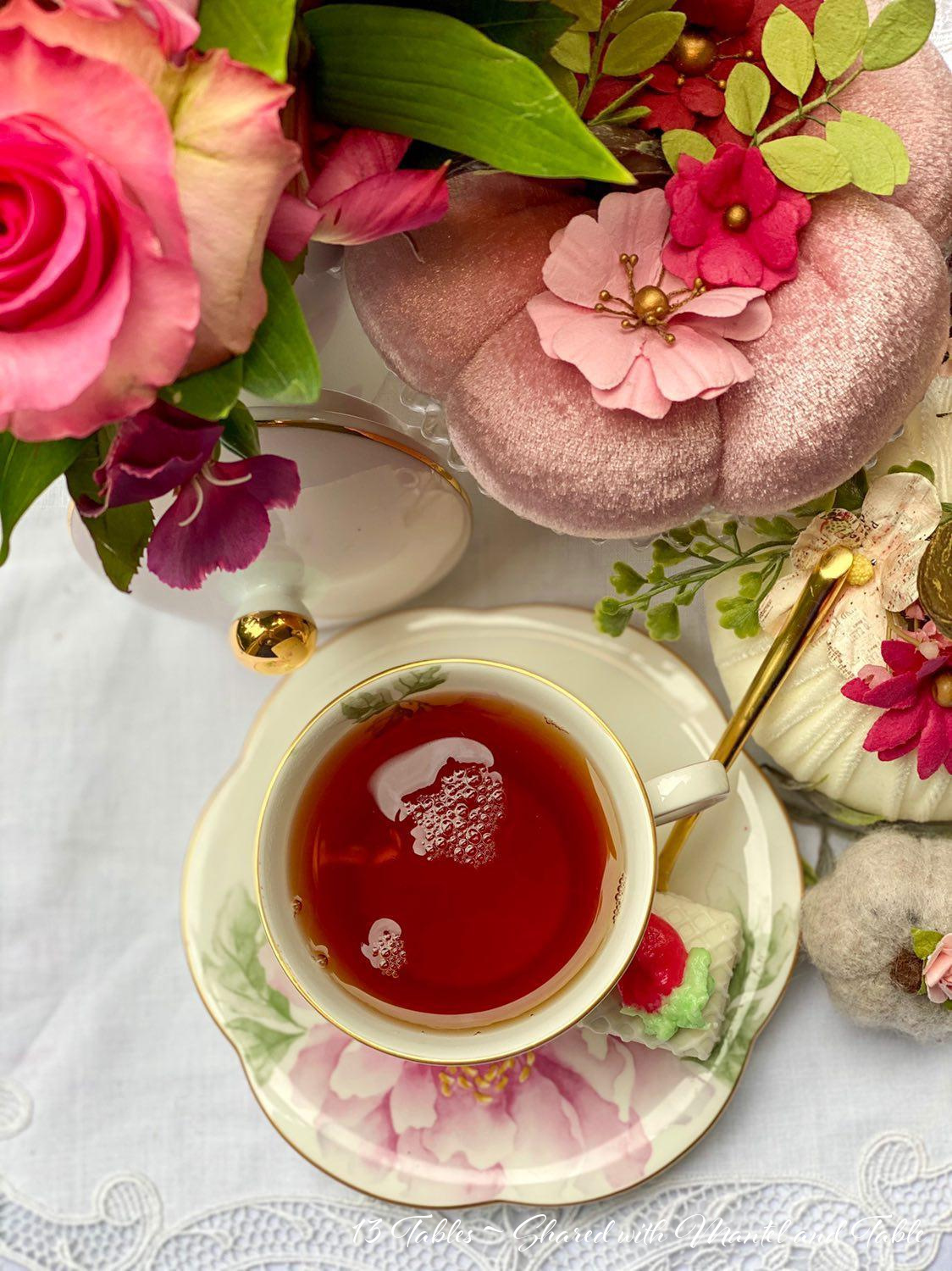 The Traveling Teacup with pink pumpkin table decoration