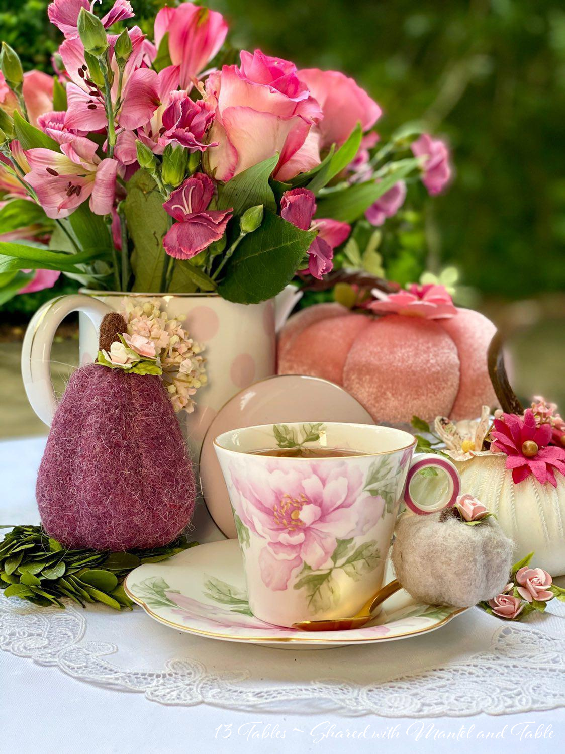 Flowered teacup with pumpkins = close up