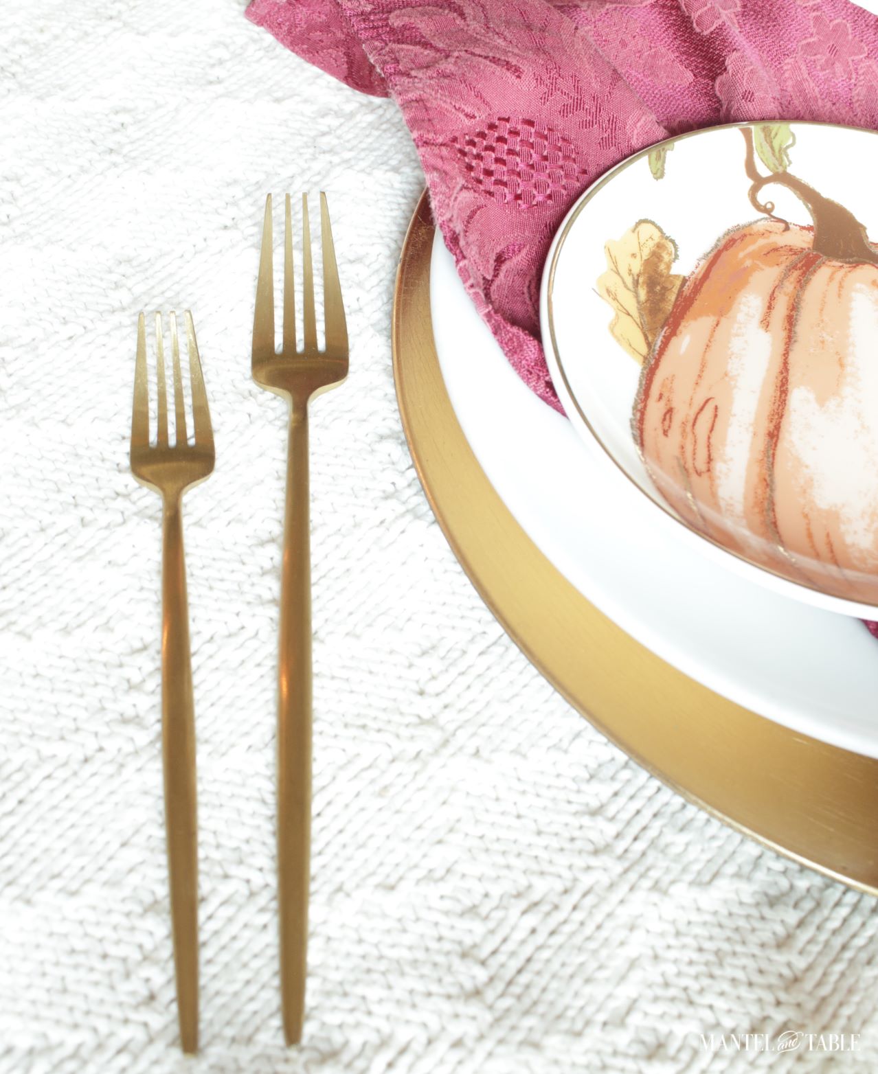 Gold forks next to plate stack